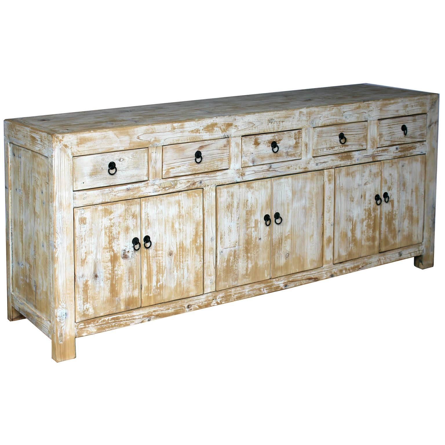 Contemporary multi-drawer white sideboard with natural wood grain. Clean and straight lines with plenty of storage makes this buffet a very desirable piece for any room in the house.