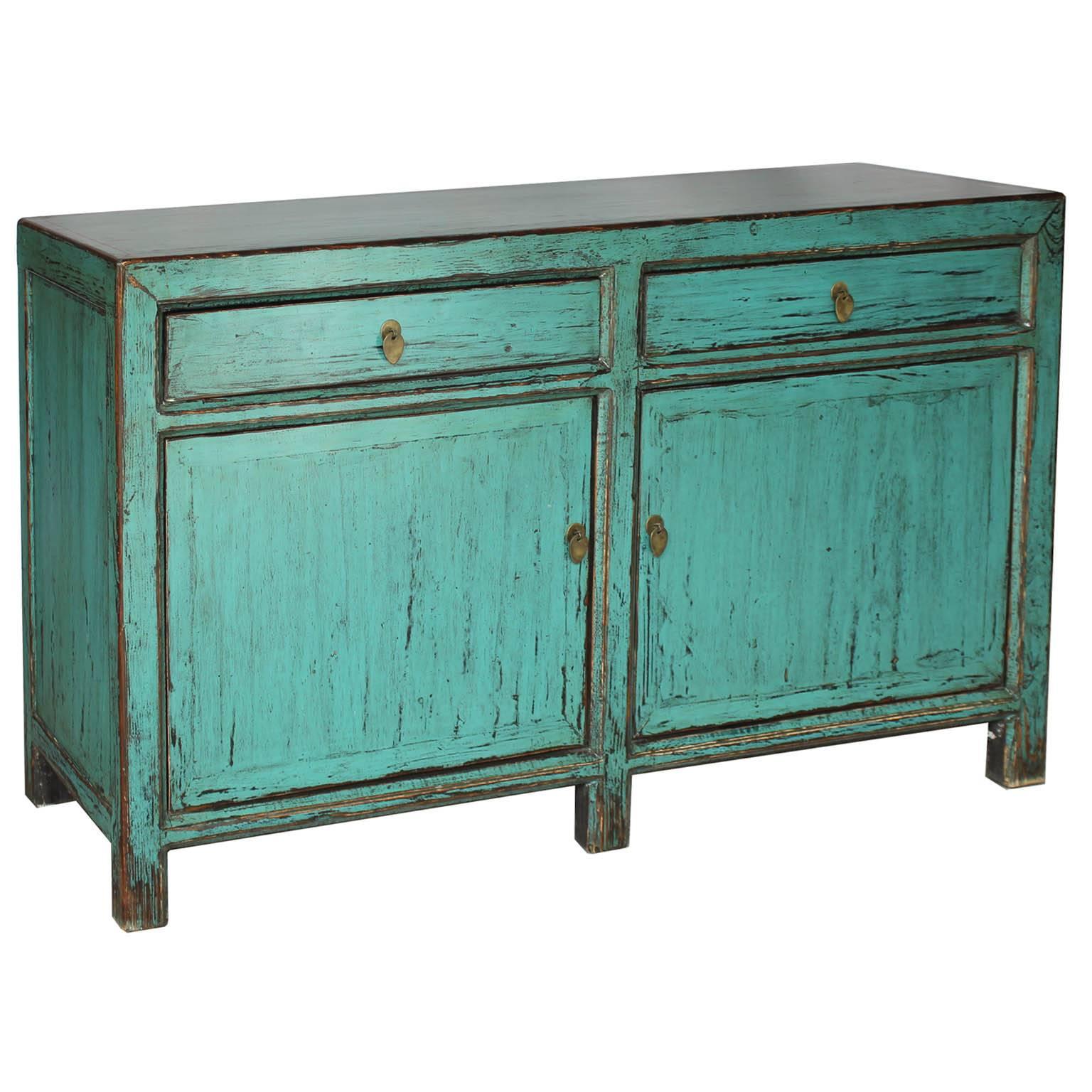 Contemporary light blue lacquer side board with two drawers and clean lines. A pop of color would look great in the living or dining room.