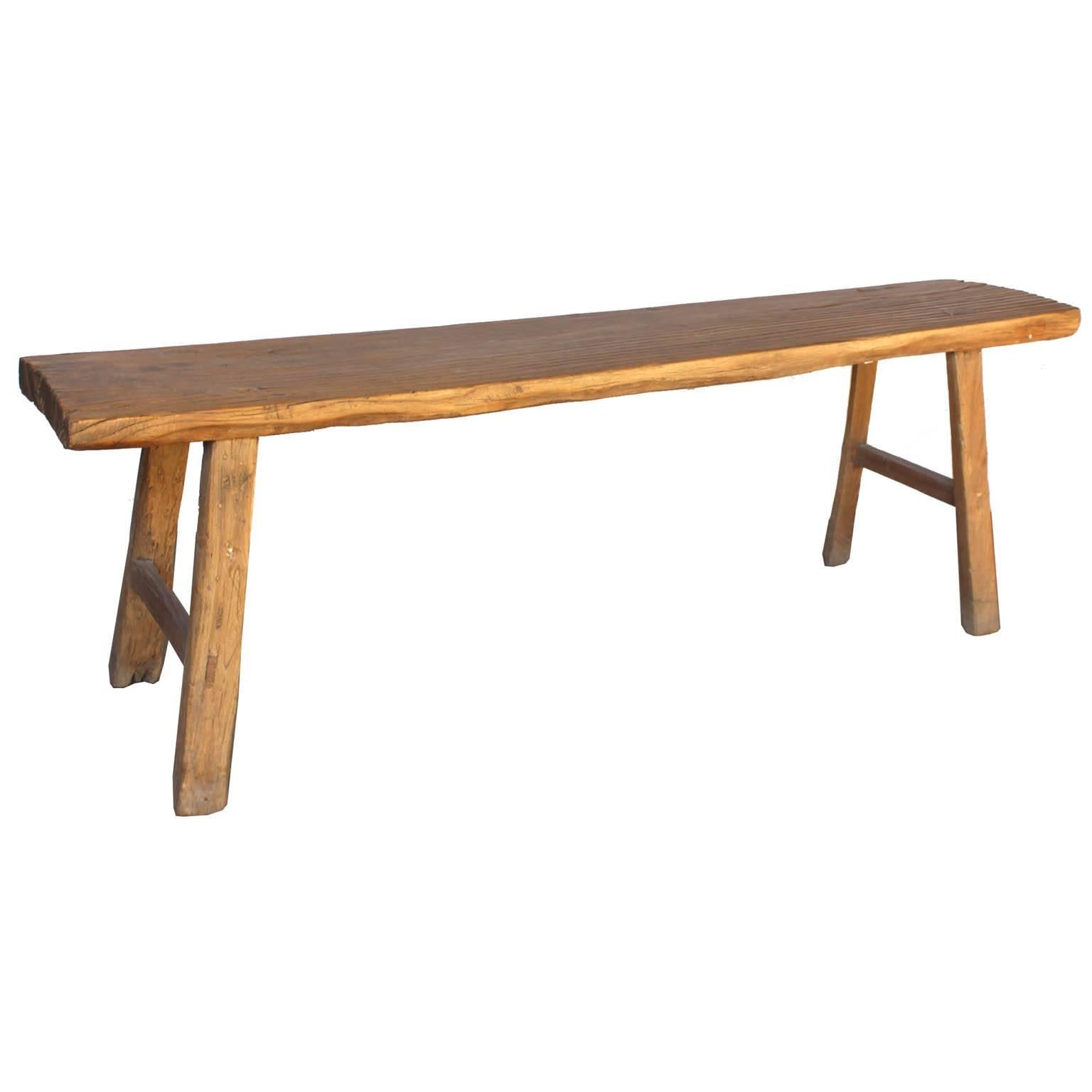 Elmwood bench with side support bars was originally used to practice martial arts. Place at the end of a bed or in the living room for extra seating.