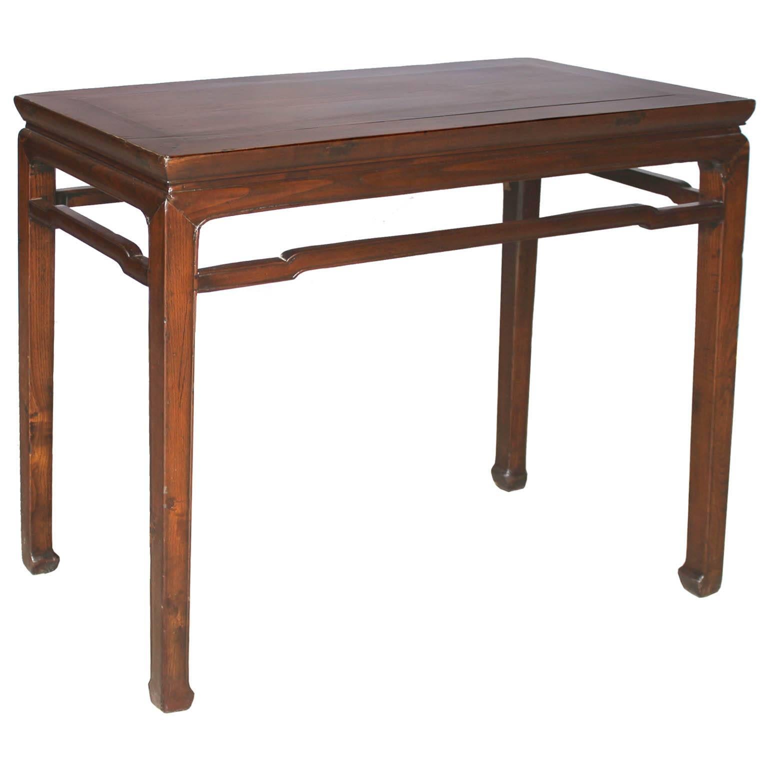 Classic console table with beautiful wood grain, support bars and horse hoof-style feet would make an elegant statement as an entryway table with a lamp and accessories on top.
