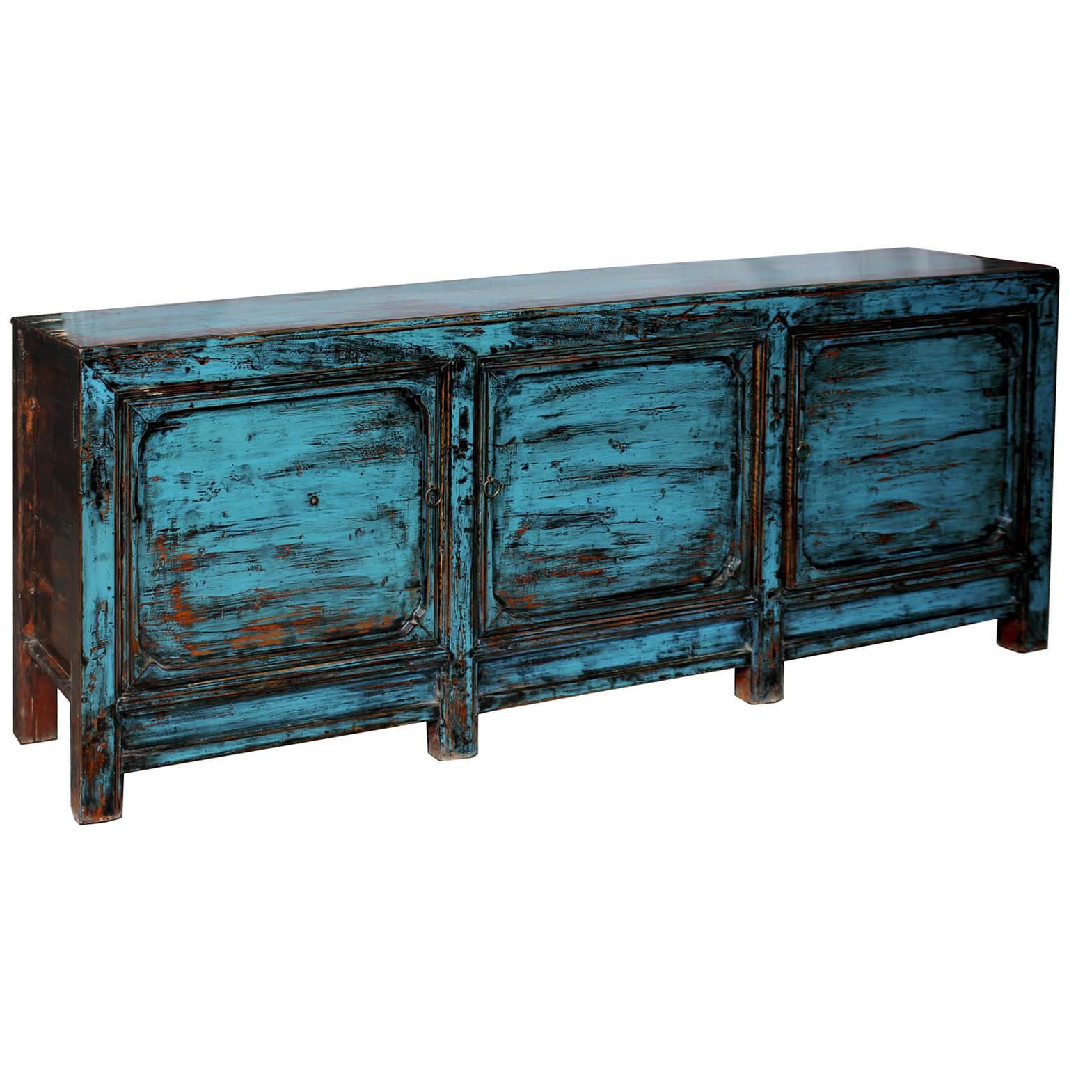 Blue lacquer sideboard features clean lines, exposed wood edges and plenty of storage. Bring color into a contemporary living space by placing beneath a flat screen tv or use as a server in the dining room. New interior shelves and hardware.