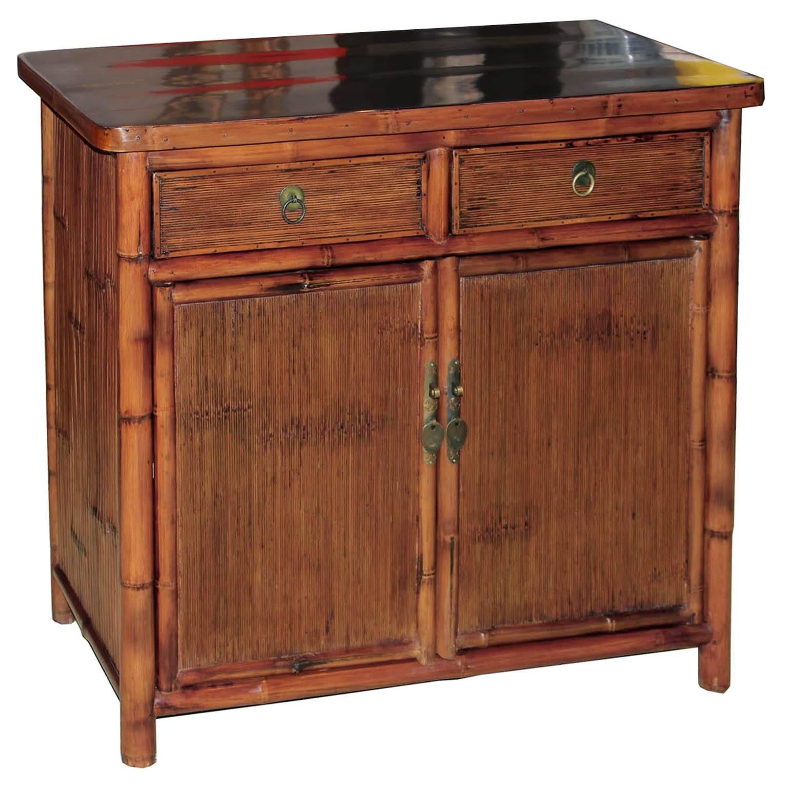 Contemporary two-drawer bamboo side chest made from split bamboo. Place next to a sofa or armchair or use as a bedside chest.