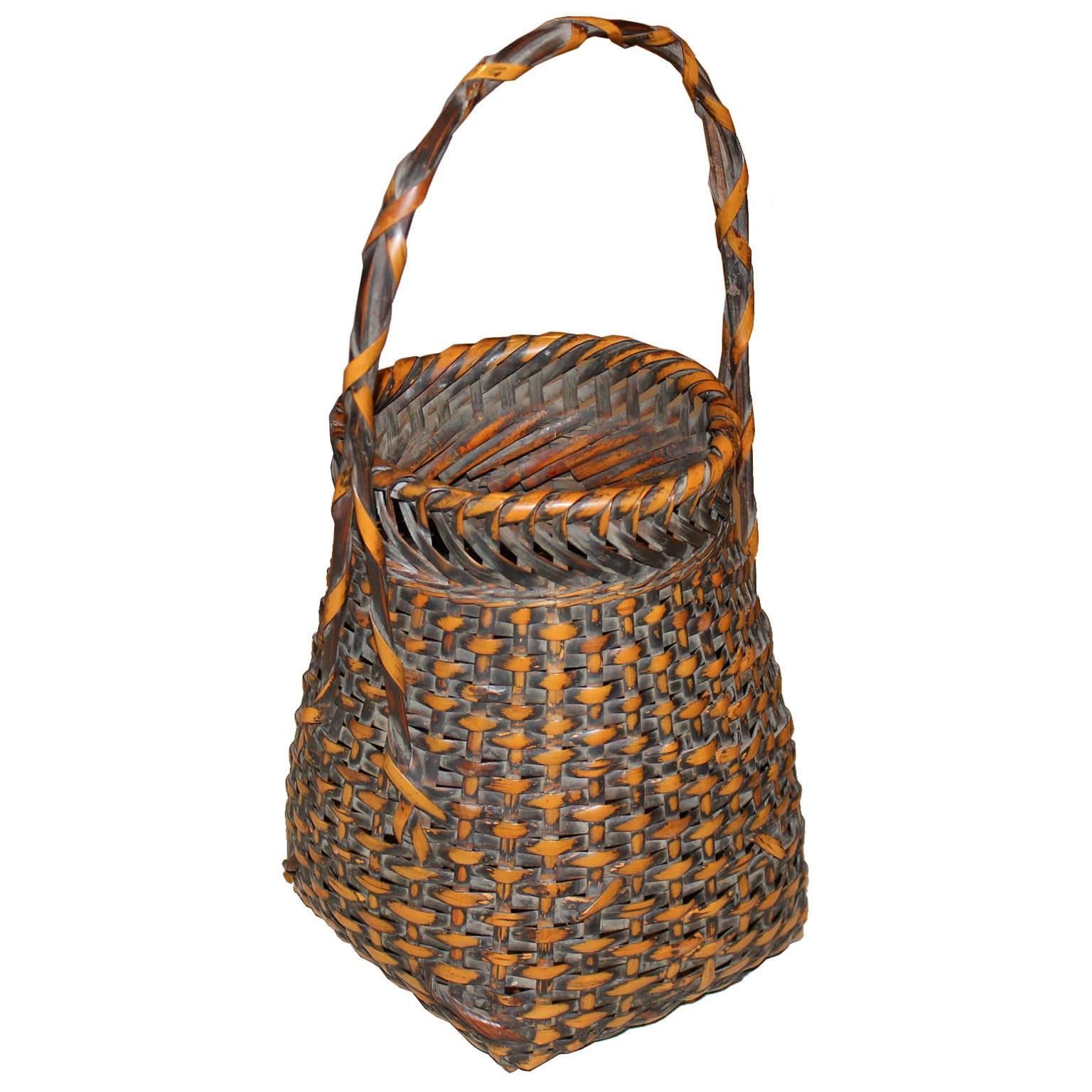 Handwoven bamboo basket originally made to hold flower arrangements for an entry way or for tea ceremonies. Taisho period, circa 1920s.