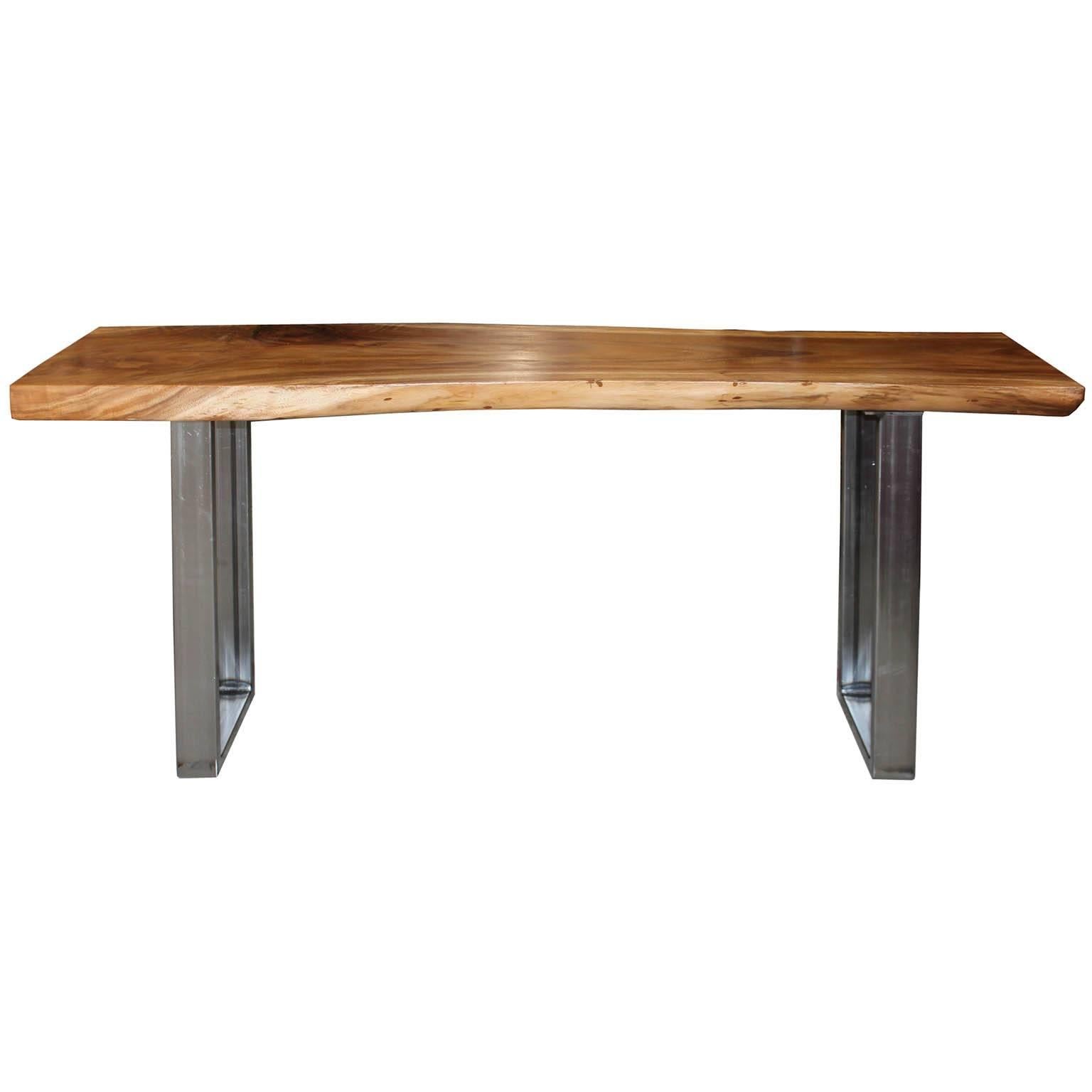 Live edge acacia wood console table on metal legs. This piece was made in Indonesia.