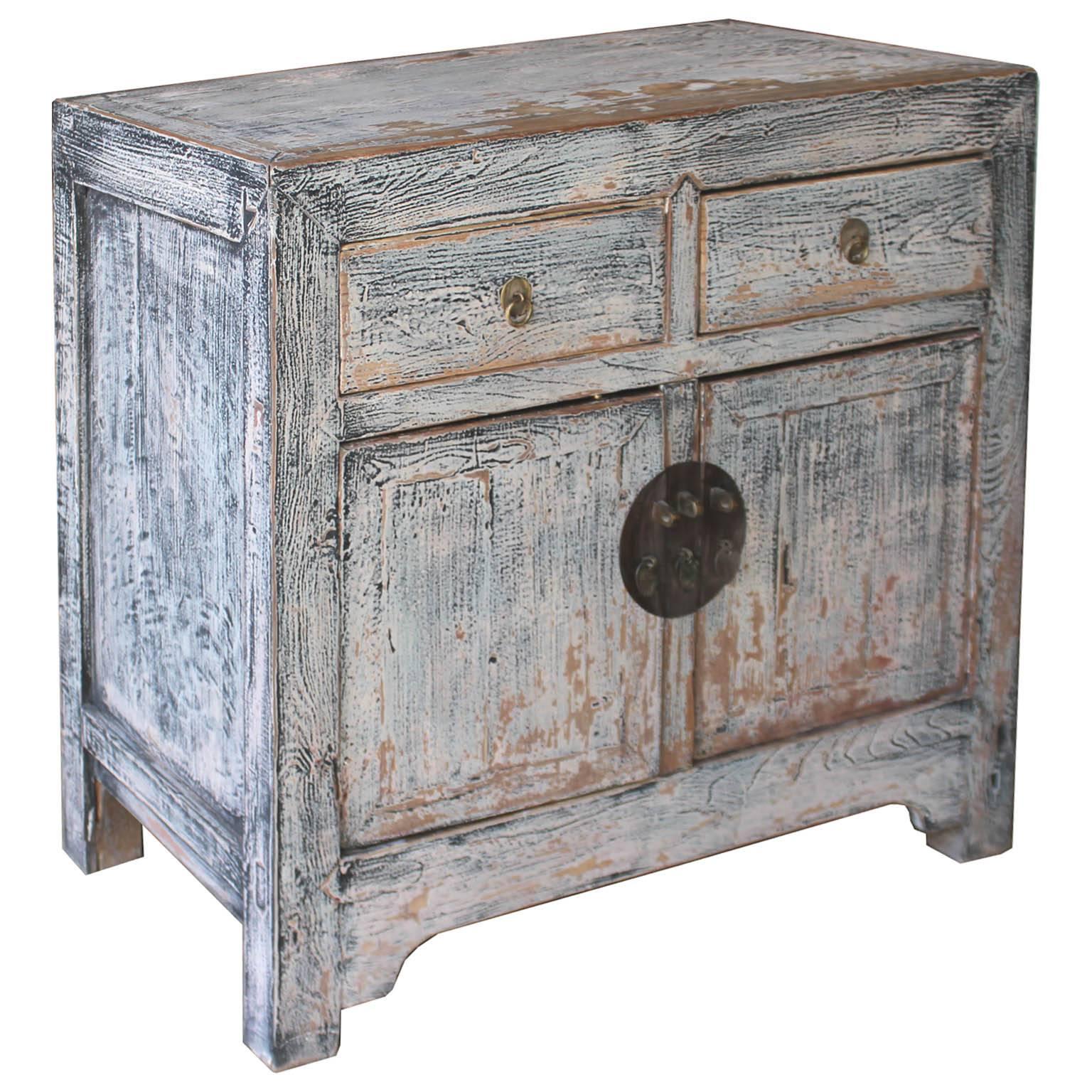 Beijing chest with exposed wood edges in a light blue/gray dry finish for a modern look. Use as a bedside chest with a lamp and accessories on top. New hardware, middle bar removes for easy interior access, circa 1920s.