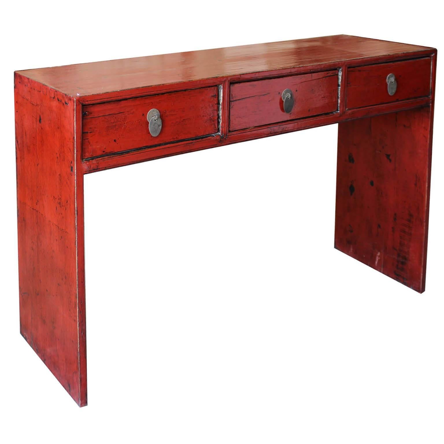Three-drawer red console table can be used as a desk to bring a pop of color into the bedroom or study. Shanxi, Chine, circa 1920s. New hardware.