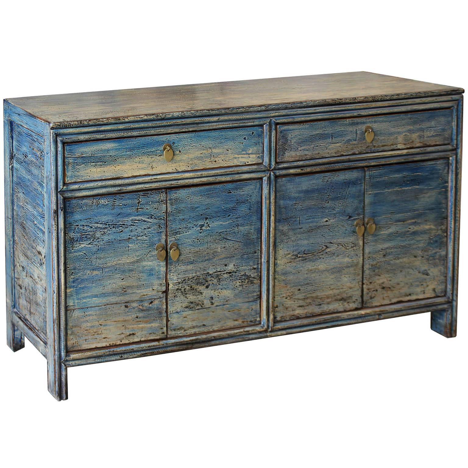 Contemporary four-door sideboard with soft blue and white marbled finished and rounded edges.