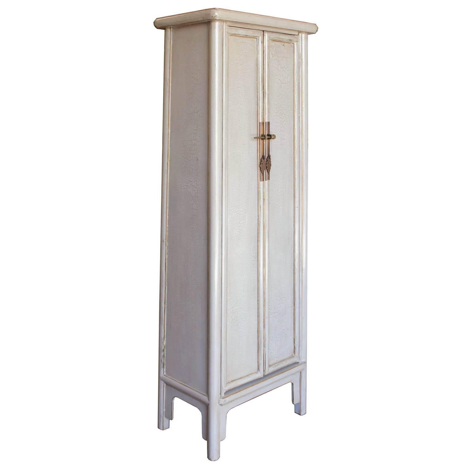 Contemporary a-line chest with light gray crackle finish can be placed at the end of a hallway or in bathroom for extra storage.