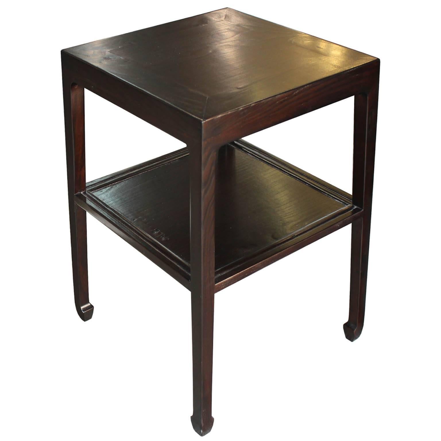 Contemporary two-tier ming style elm side table. Put two together for a unique coffee table.

 