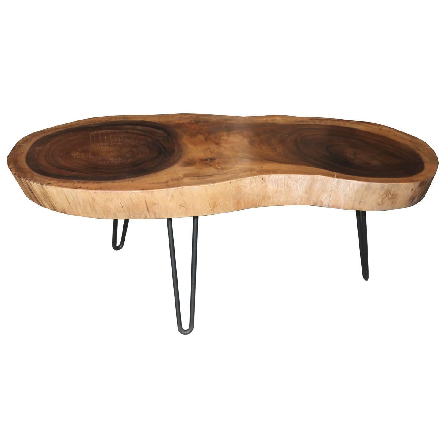 Javanese suar wood coffee table with metal pin legs. Depth of table ranges from 19-22