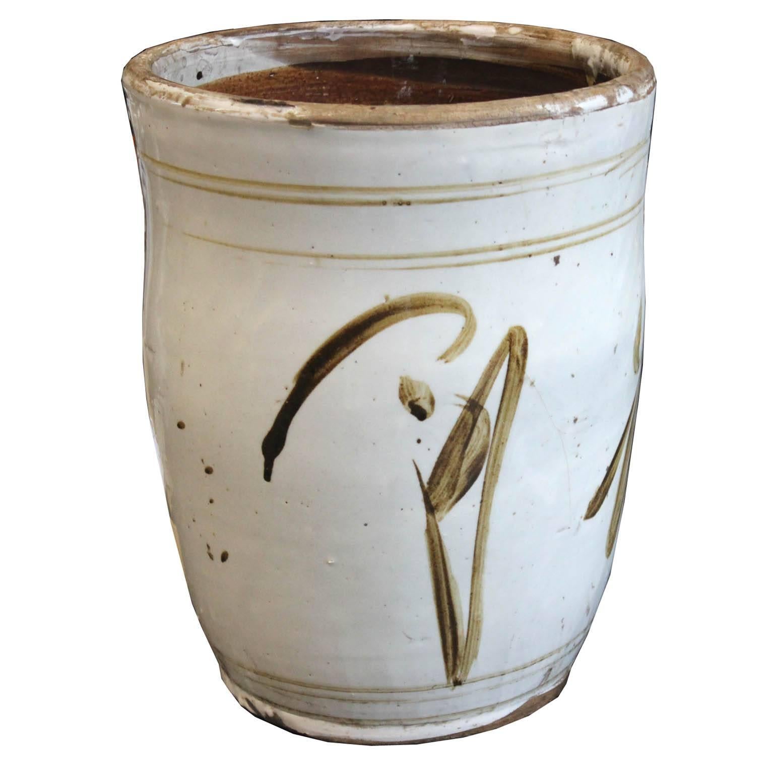 Cream color pottery was used to store grain for a household. A perfect container for a plants, orchids or magazines. From China's Shanxi province, circa 1890s.