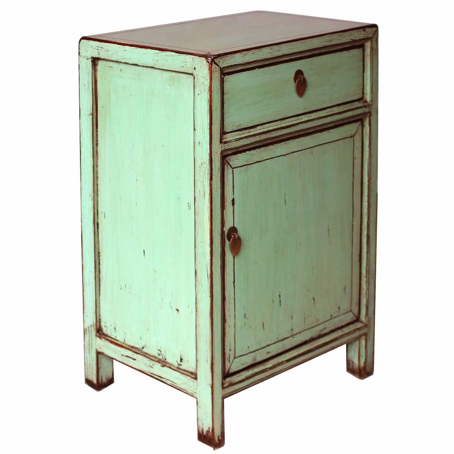 Contemporary one-drawer side chest with exposed wood edges and mint green lacquer finish will add a pop of color to a modern bedroom. Priced individually at $ 1550 each.