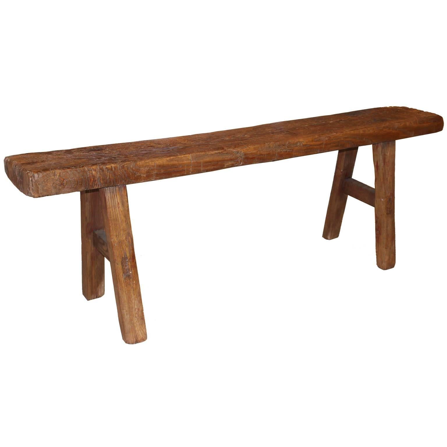 Elmwood bench with side support bars. Originally used to practice martial arts. Measures: Seat depth 9