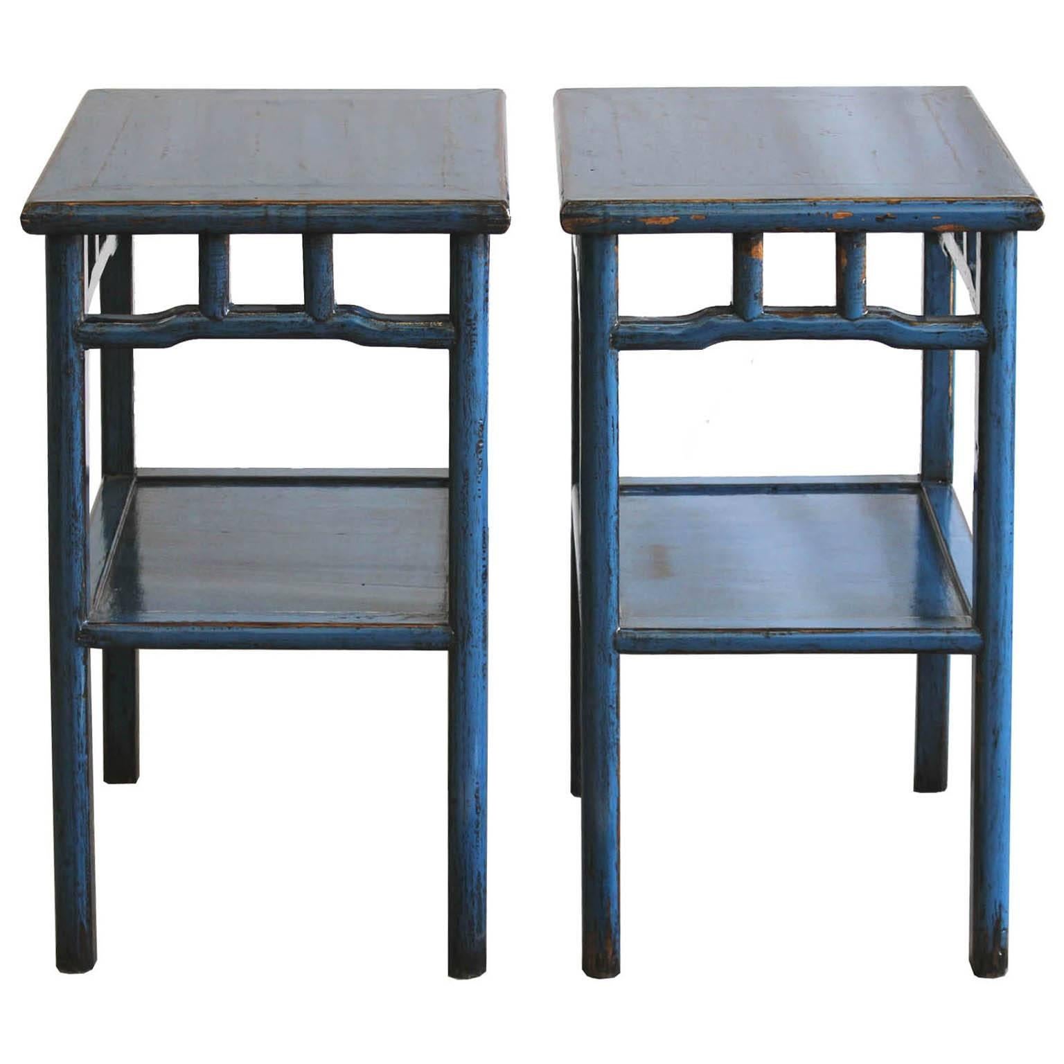 Contemporary blue lacquer end tables with exposed wood edges and bottom shelf can be used as bedside tables. Available individually.