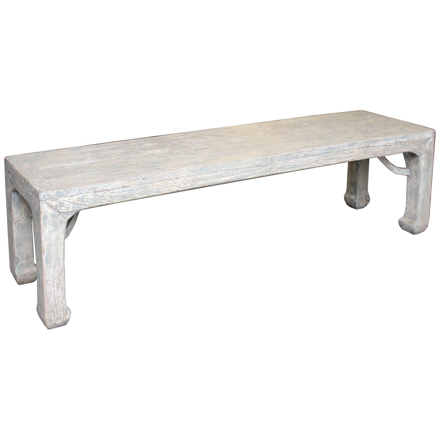 Long bench with unique matte cream and blue finish and wonderful elmwood grain. Curved arm braces below the top surface and horse hoof feet. Made from an old recycled door. Perfect at the end of the bed or use as extra seating in a contemporary