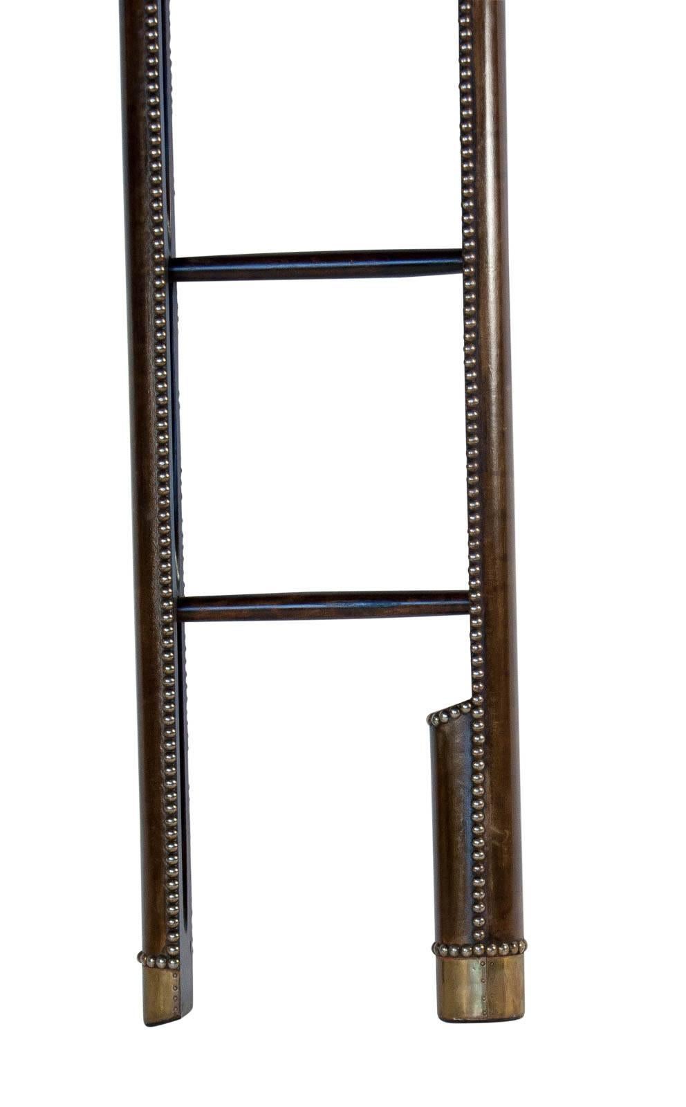 A handsome and scarce folding ladder perfect for getting on and off elephants or climbing (at your own peril) around your library. These where found in the stately homes of England and originated in India during the Anglo Indian Period. They are