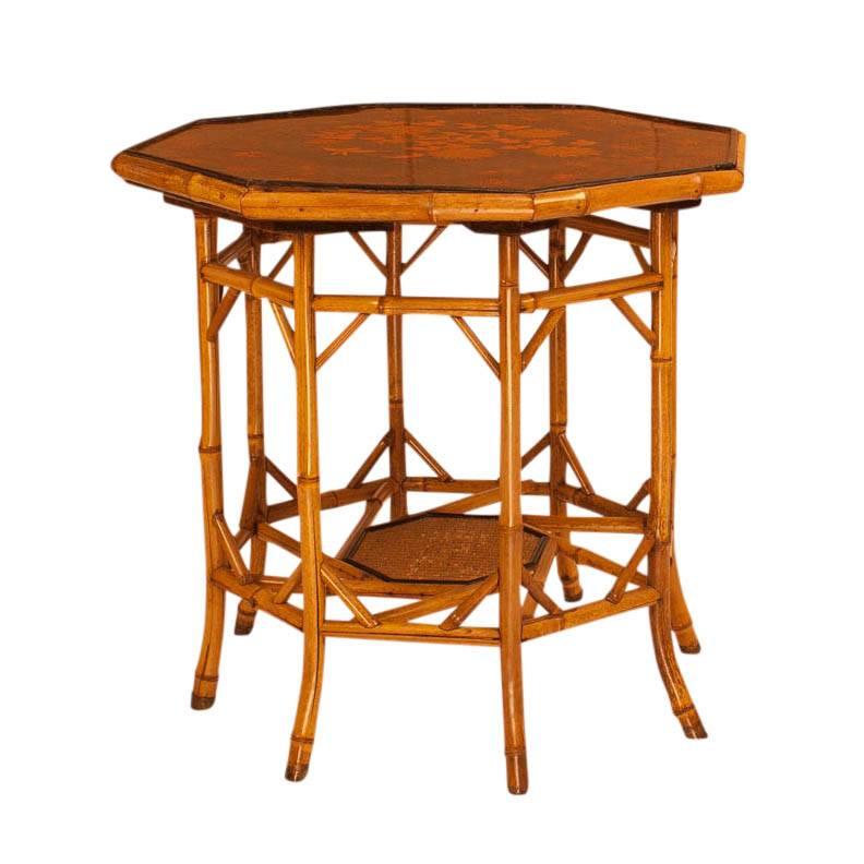 Bamboo and lacquered large octagonal table made in the oriental taste. Inset lacquer panels decorated with Japanese motifs, England, circa 1880. In wonderful restored condition. A design I have rarely seen.