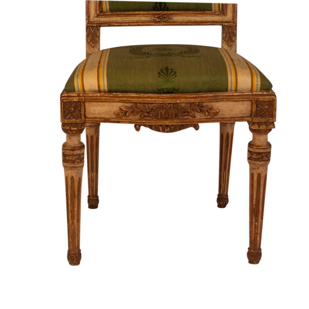 Late 18th Century Four French Louis XVI Cream Painted and Gilt Side Chairs, circa 1780