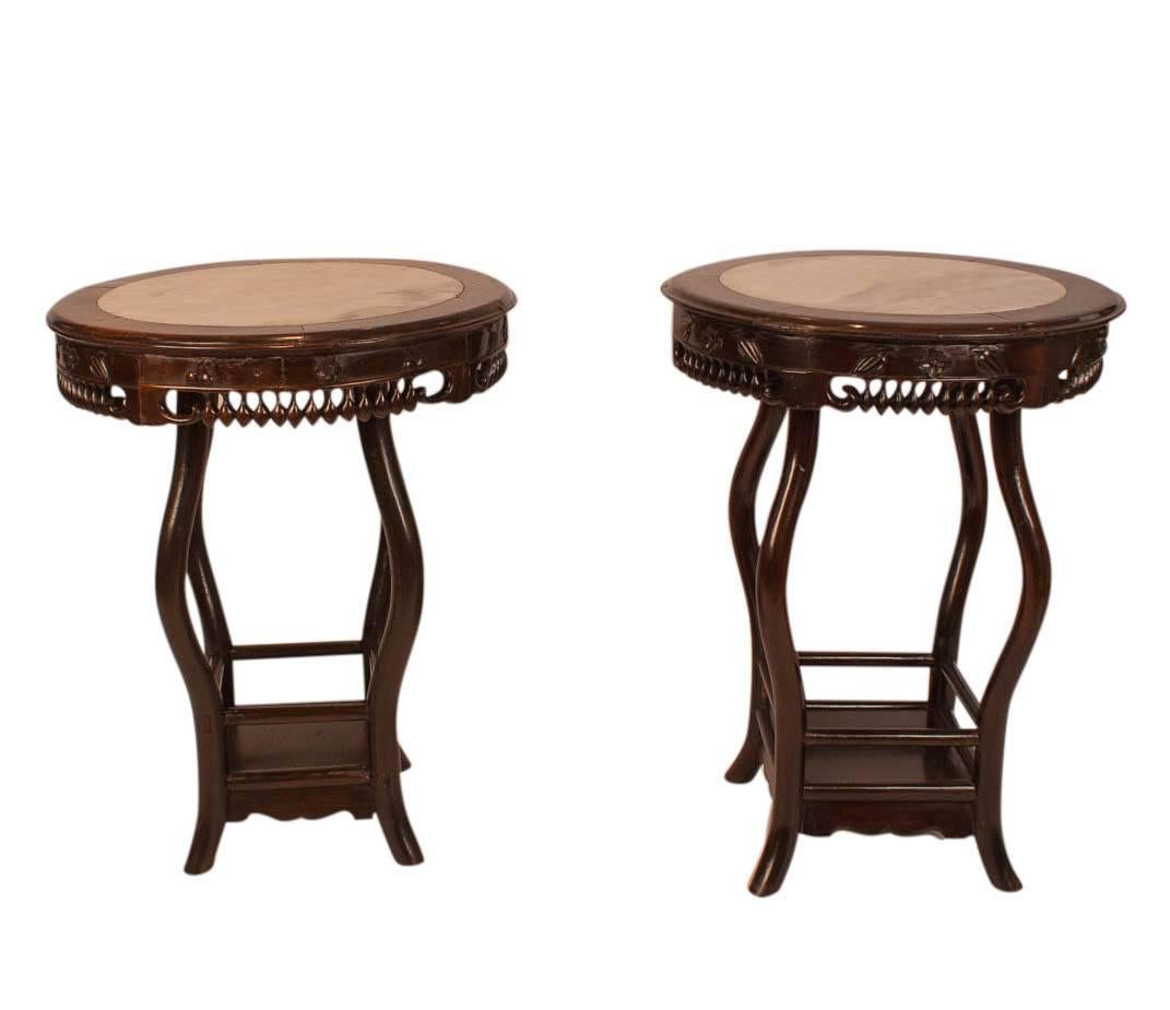 A good pair of late 19th century Hong Mu Chinese round tables with nicely carved apron and inset marble tops. Made in China, circa 1890. Recently tightened and polished. Good color with nice patina. 


 