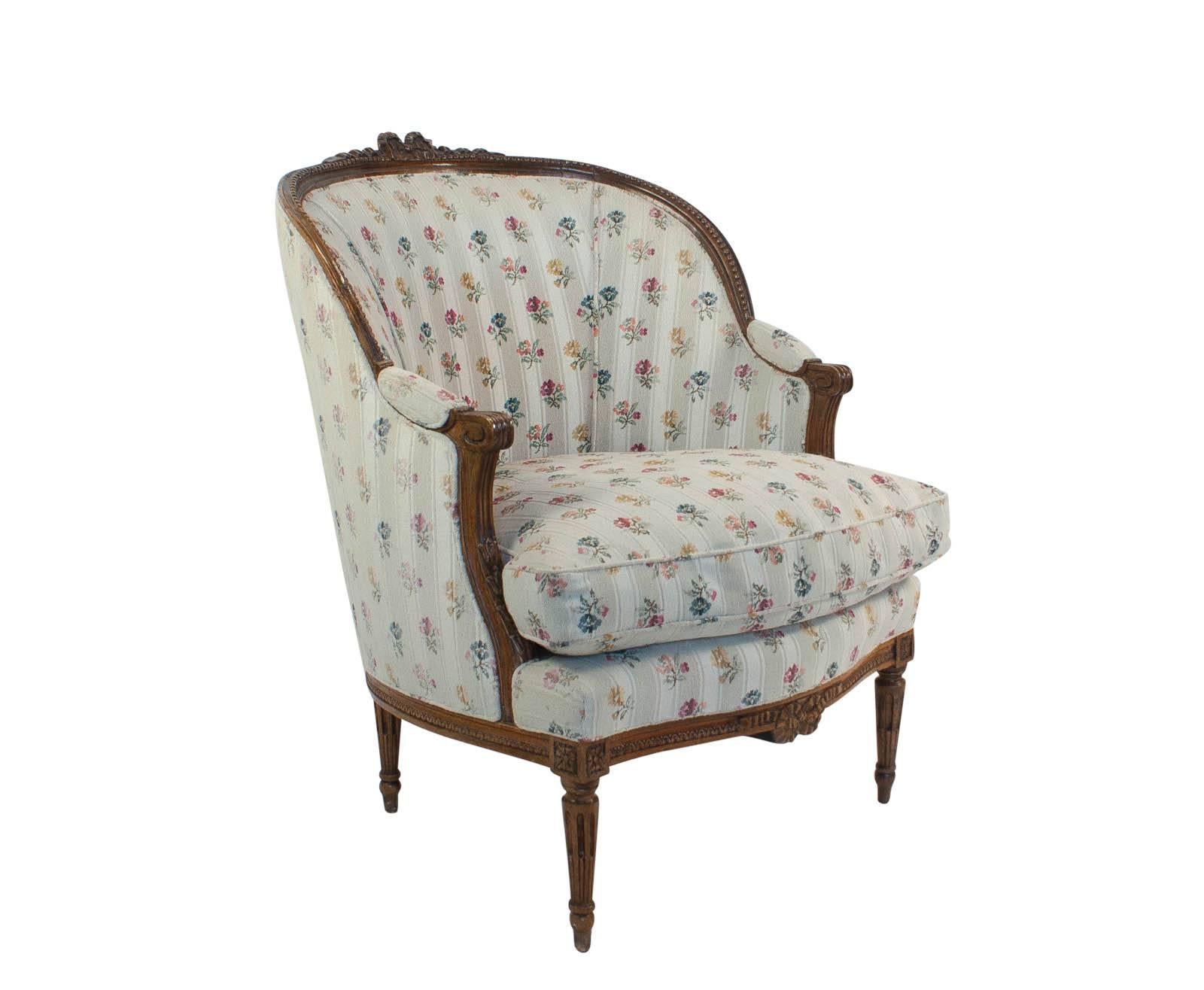 A large Louis XVI style fruitwood Bergere made in France, circa 1880. A Classic chair designed for comfort. Upholstery is older. Perfect for sitting by the fire and reading a book.
