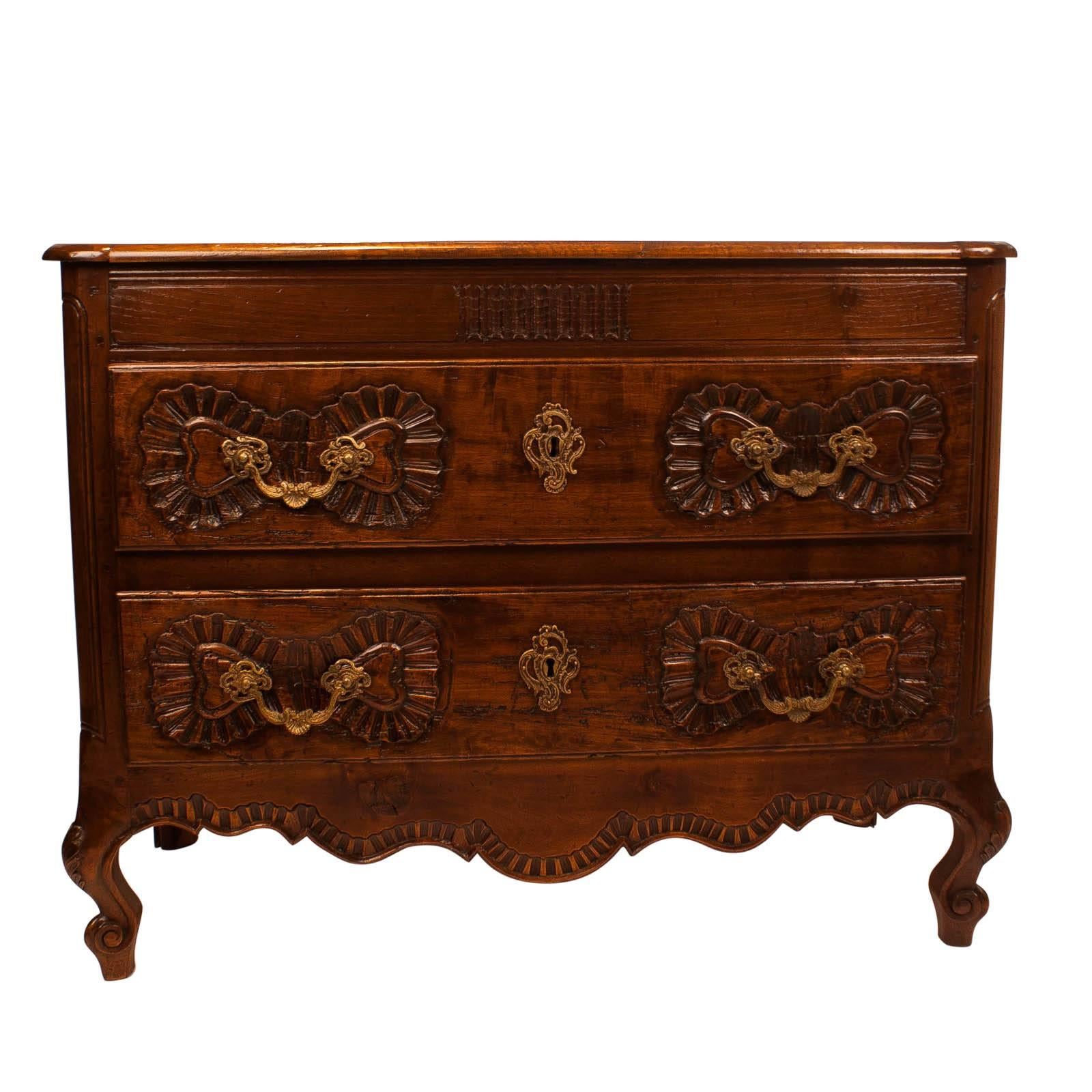 A good smaller scale walnut two-drawer chest made in Spain or Portugal circa 1840. The size and bold decoration are particularly nice. Collected in Northern Spain, circa 1950. Drawers work well. Recently professionally tightened and polished.