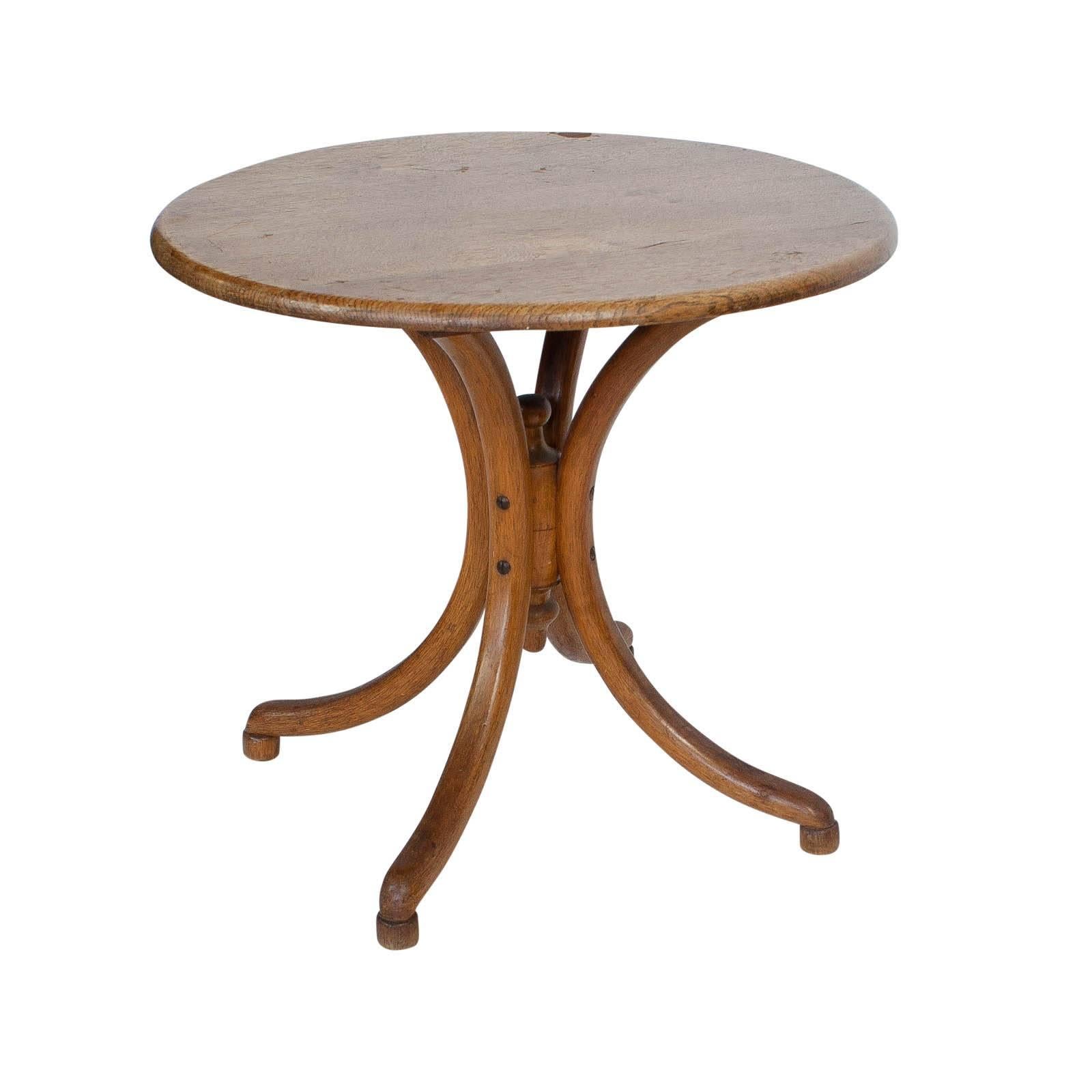 A miniature Thonet round child's table in oak, Austria, circa 1900. Great as a side table or coffee table.