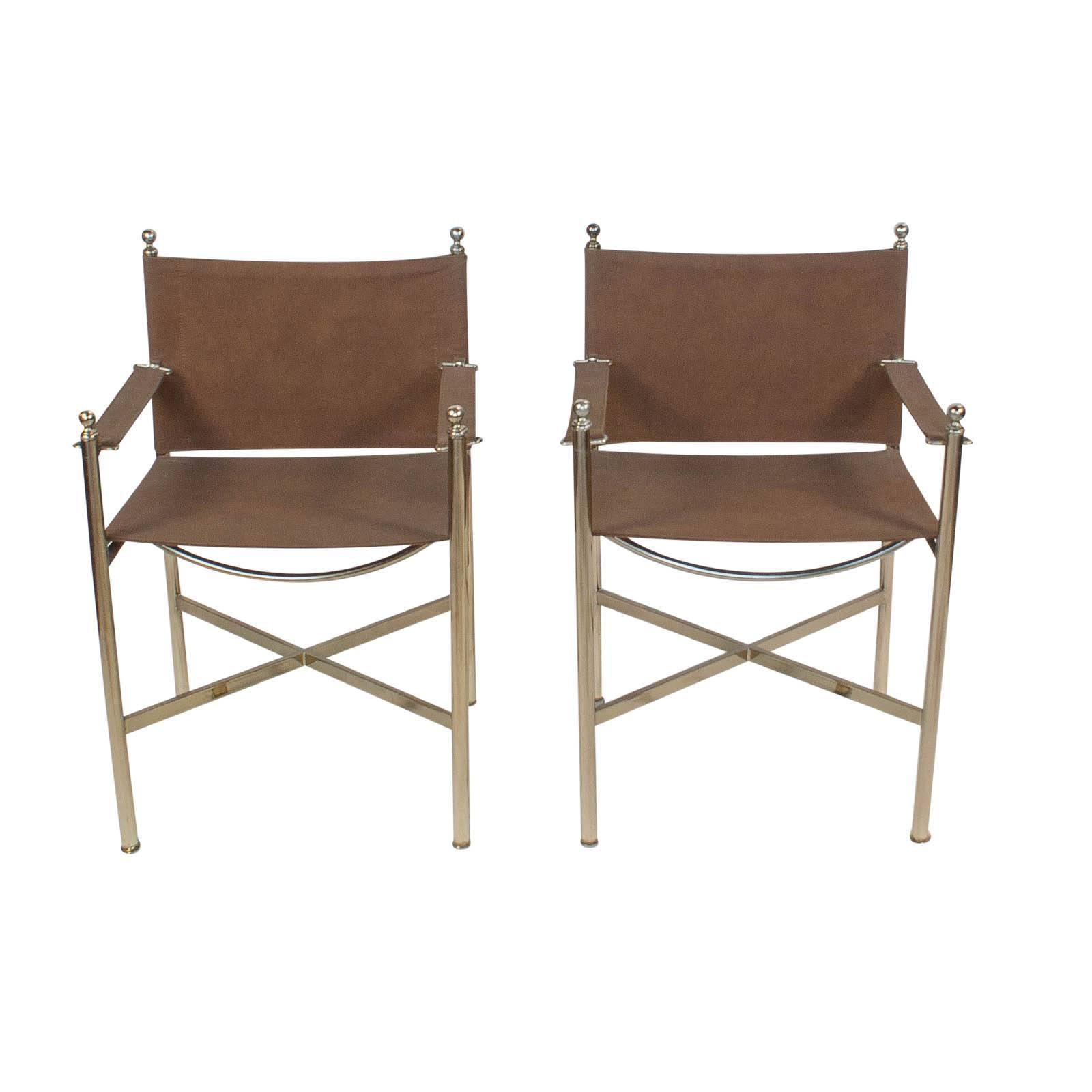 A pair of steel and brass directors chairs attributed to the French firm of Jansen circa 1950. Priced as pairs. Another pair available. Suede upholstery probably 20 years old but in good condition.