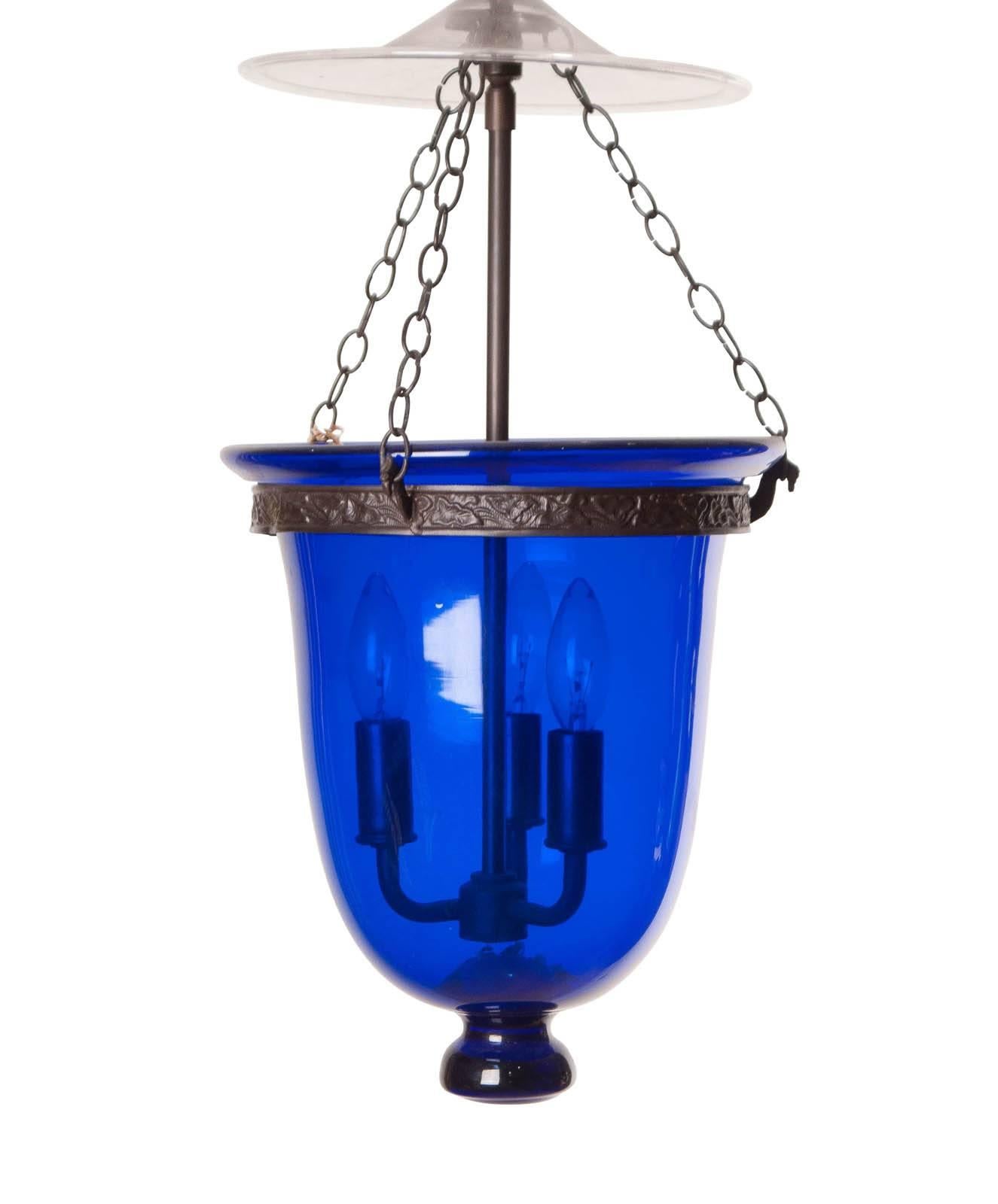 From the collection of a dealer that specialized in decoration from S.E. Asia. This blue glass lantern / bell jar / hundi, was made in or around India, circa 1860. The clear glass cover is antique but associated. The wiring is recent and in good