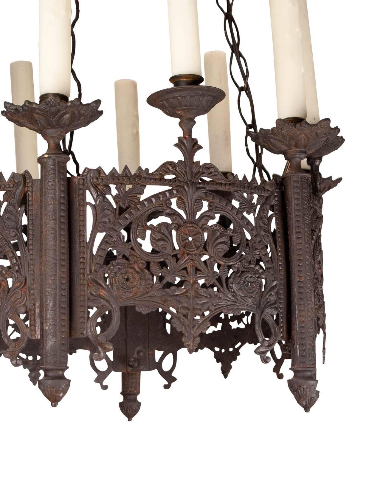 A handsome and large Gothic style metal chandelier made in during the last part of the 19th century. Recently wired with new candle covers.