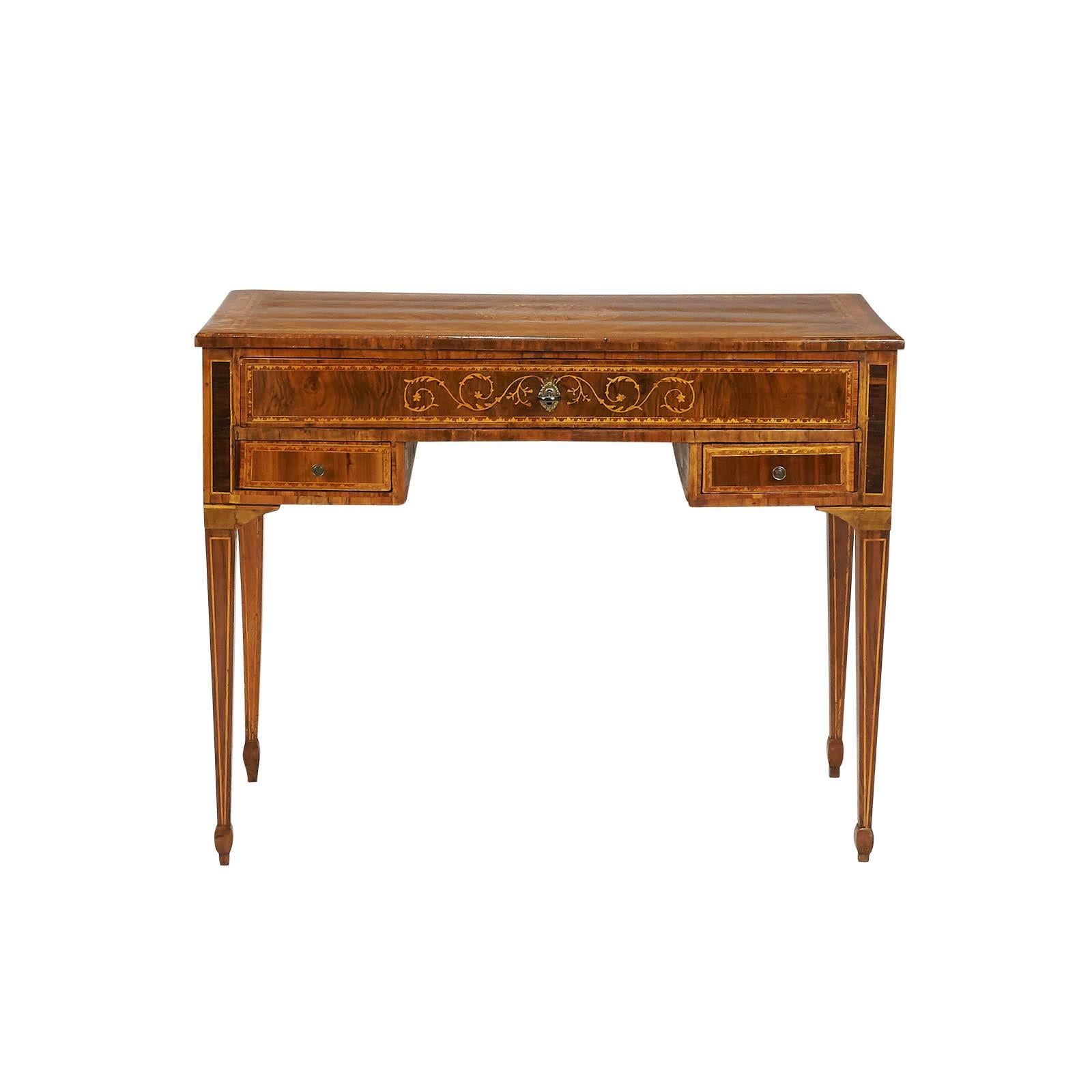 A 19th Century Neoclassical inlaid writing desk or dressing table, Italy circa 1820. The desk has one long drawer over 2 short drawers, the top drawer has been relined, recently polished.

