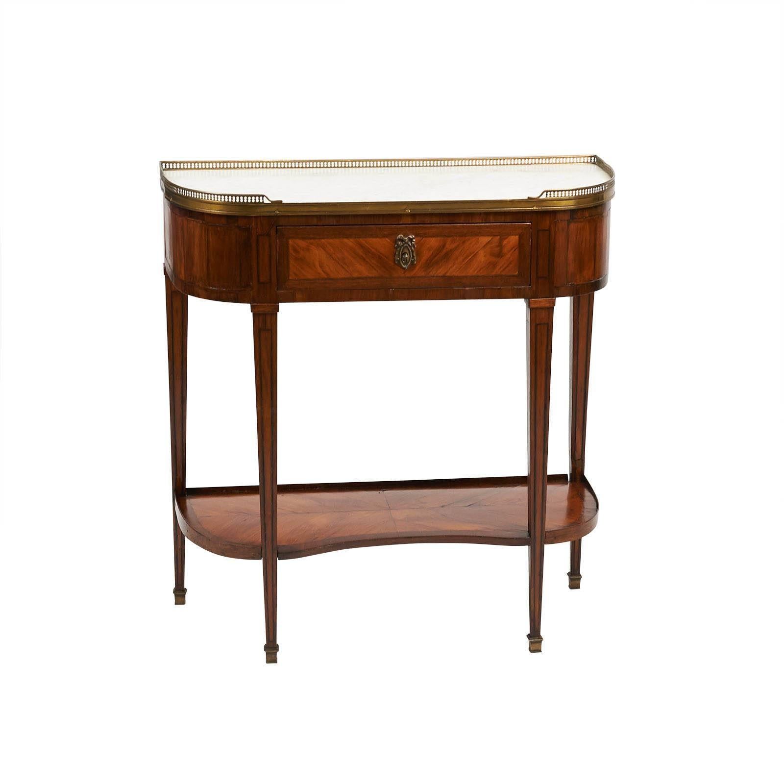 A very nice neoclassical Swedish side table in king wood with marble and gilt brass accents. Modeled loosely on a Louis XVI console desert although much smaller than any French example I have seen. Marble tops and the smaller size make this