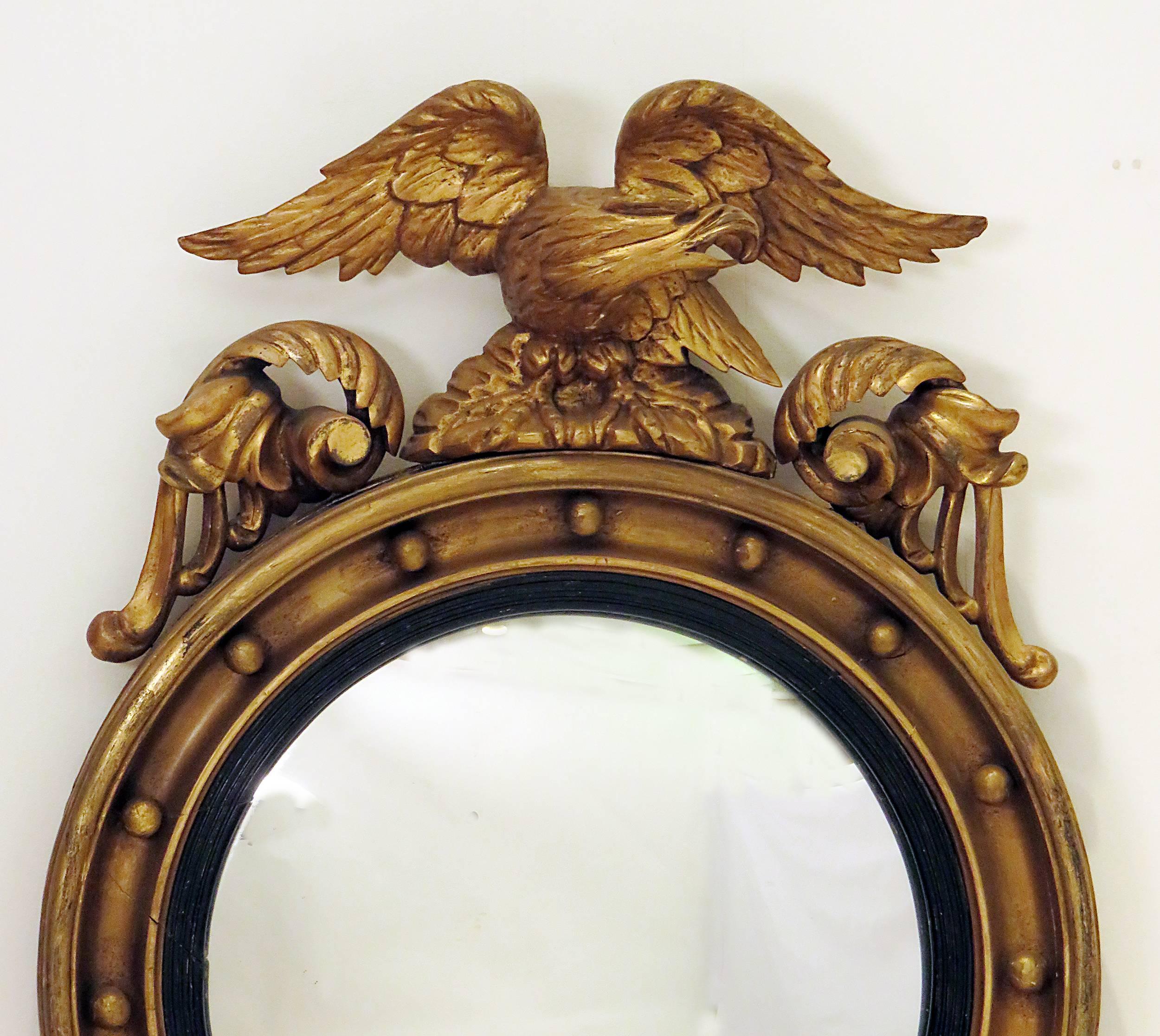 A nice convex giltwood mirror made in England during the 19th century. These mirrors are from the second half of the 19th century. The easiest way to spot a later mirror is that usually they have few applied gilded spheres. The earlier examples seem