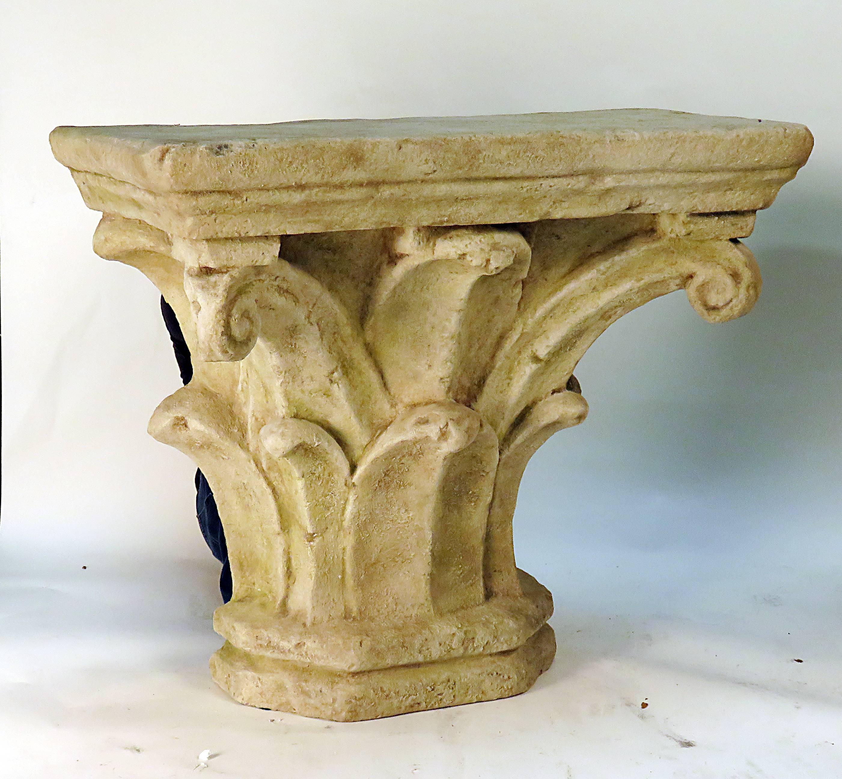 A chic cast stone console table designed and sold by Michael Taylor from the 1970s. Inspired by ancient column capitals from ancient Greece and Rome. We don't see these pieces come up on the secondary market as they where always luxury purchases. We