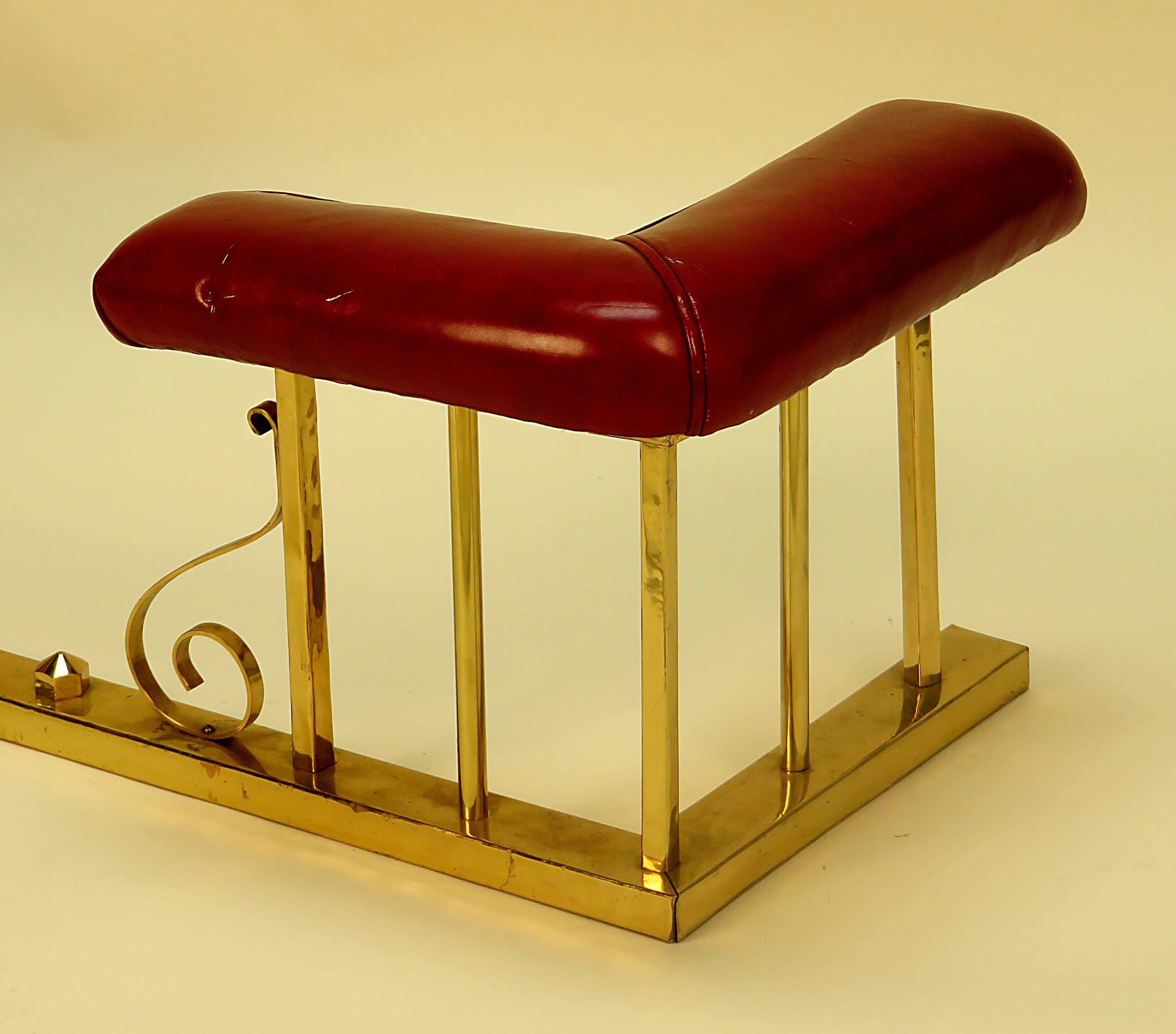 We where very happy to see this smaller scaled fire / club fender.  It is from a good collection and was made in England about 1900.  It is upholstered in Red Leather and the brass is in nice slightly worn condition.  These where meant to provide a