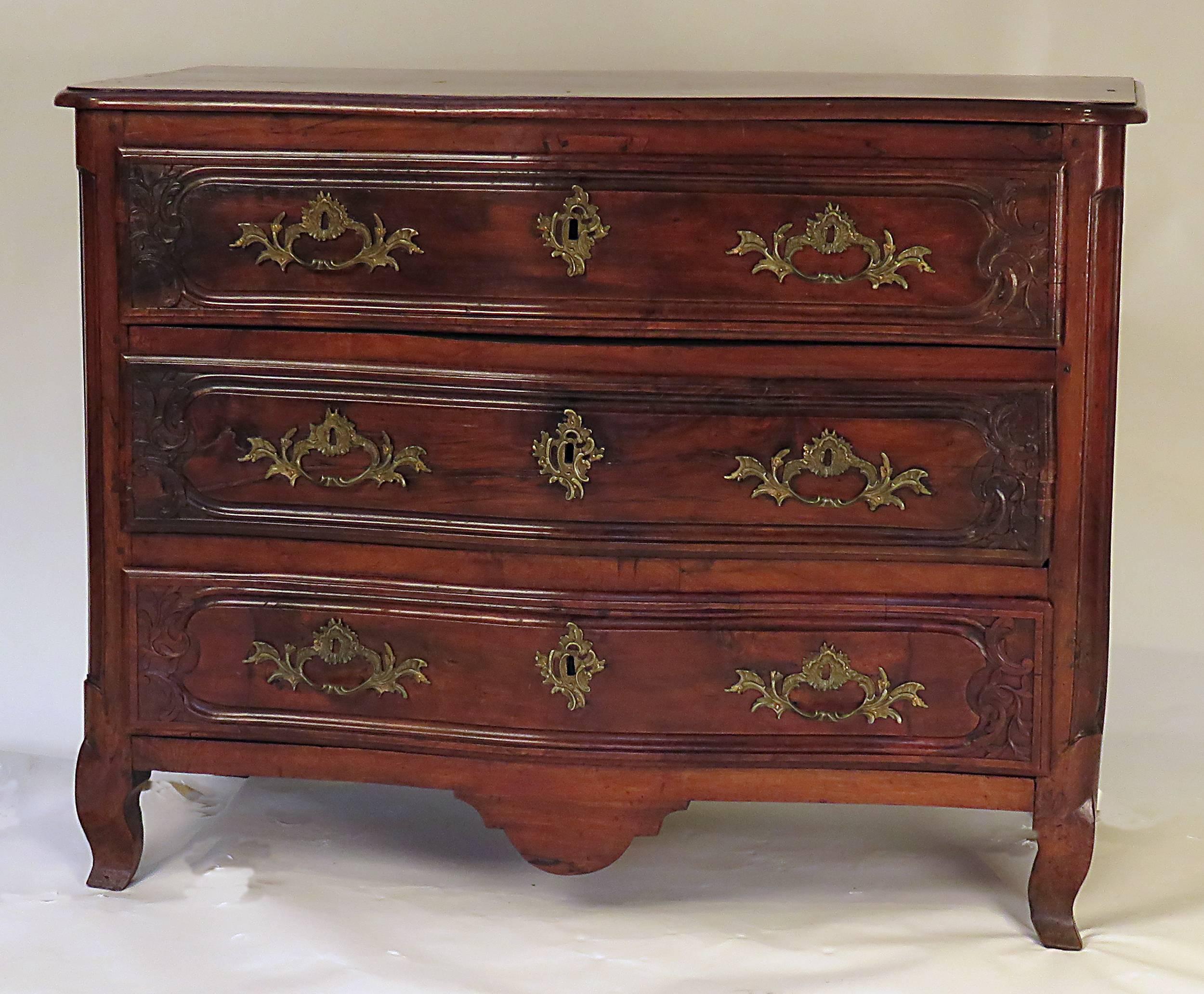 A handsome and well carved Louis XV walnut chest/commode made in Italy during the last quarter of the 18th century. Nice rich color with a good older surface. Drawer liners with reinforced runners so that they open easily. A substantial piece that