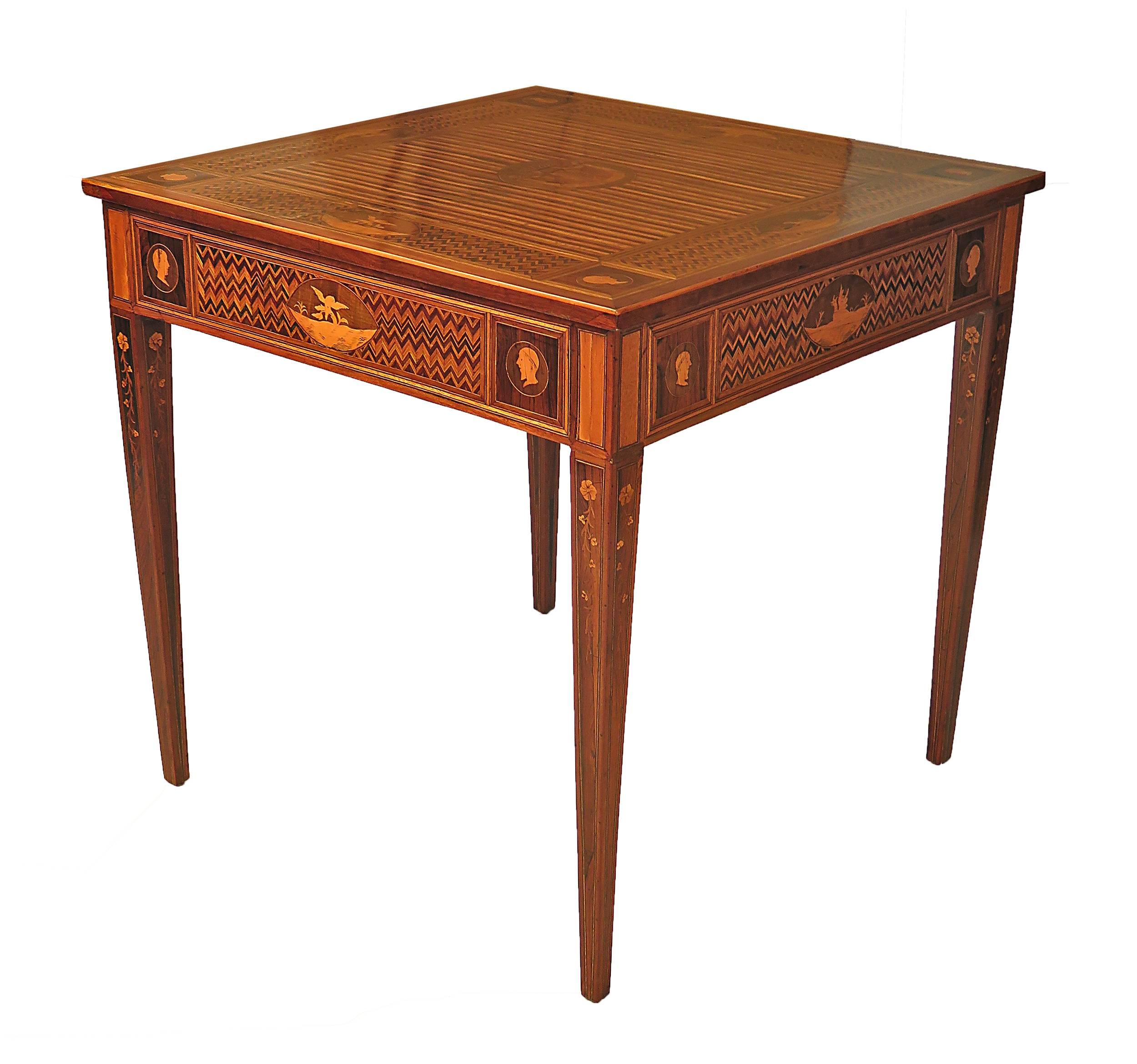 The richly inlaid surface of this useful Italian neoclassical square table suggest the work of Magiolini or possibly the work of someone greatly influenced by his designs. Pieces like these exists in fairly small numbers. The inlay was very labor