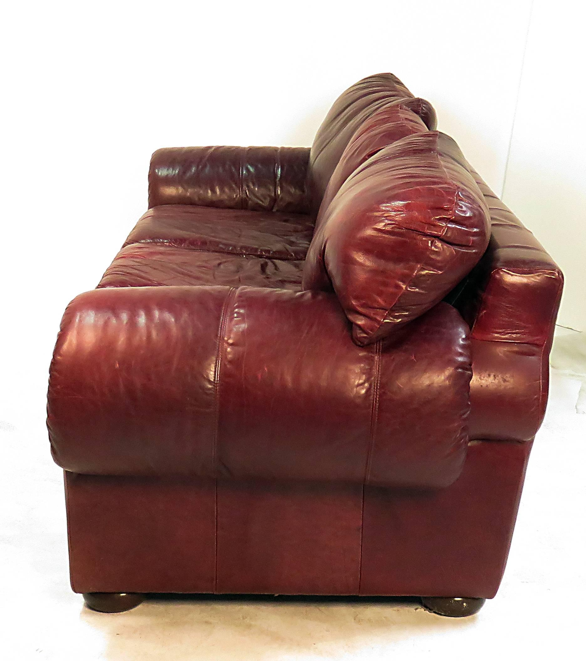 A reinterpretation of a Classic English Chesterfield leather sofa. This was barely used with the sleeper mattress still in its' wrapper. It is a very comfortable piece with large and plush cushions. We need to verify dimensions. We are confident