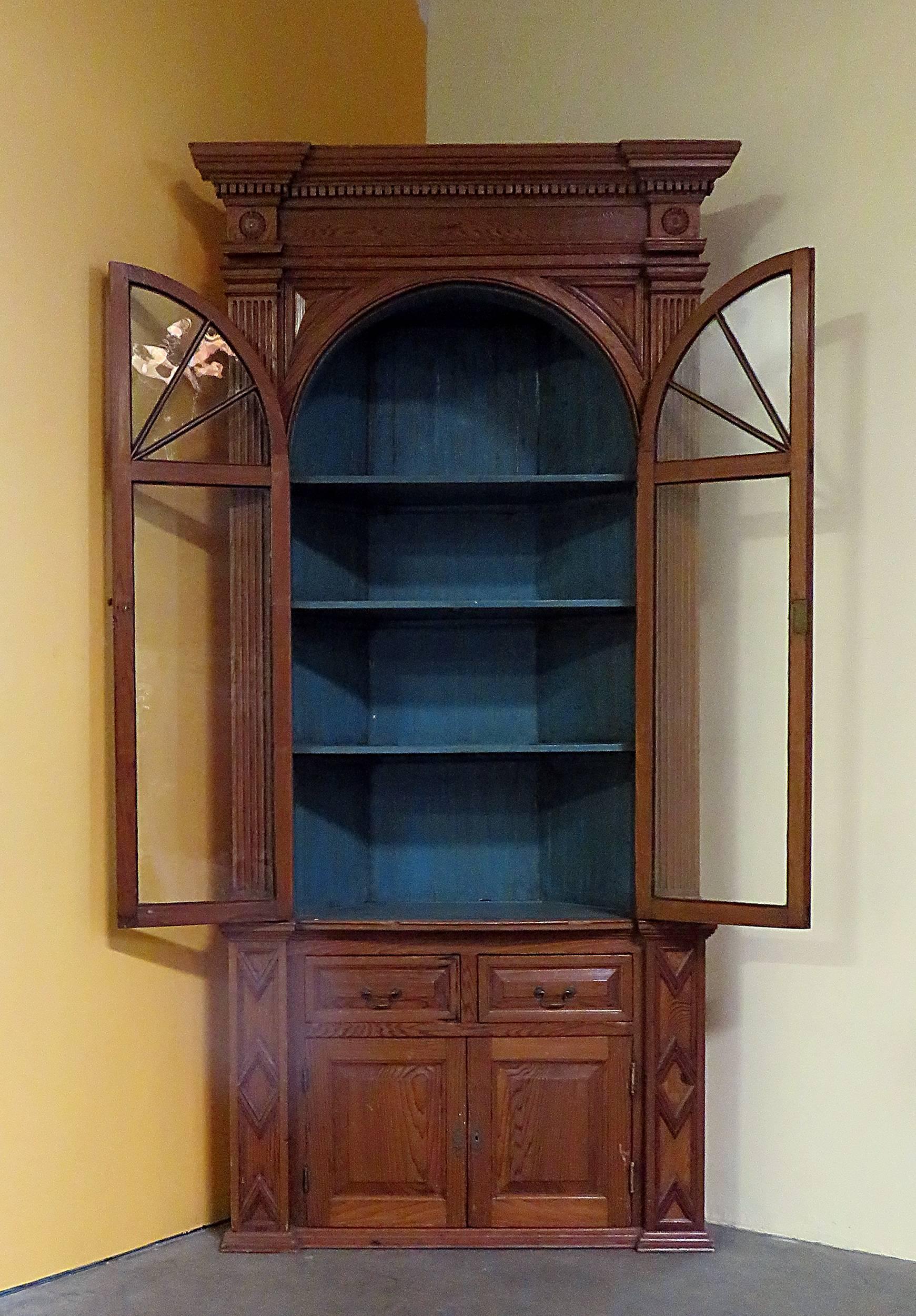 This large and handsome piece was formerly built in to a room. Made in England during the first half of the 19th century. Fantastic storage and great architectural detail. This cabinet is in one piece so it is probably best suited for 1st floor