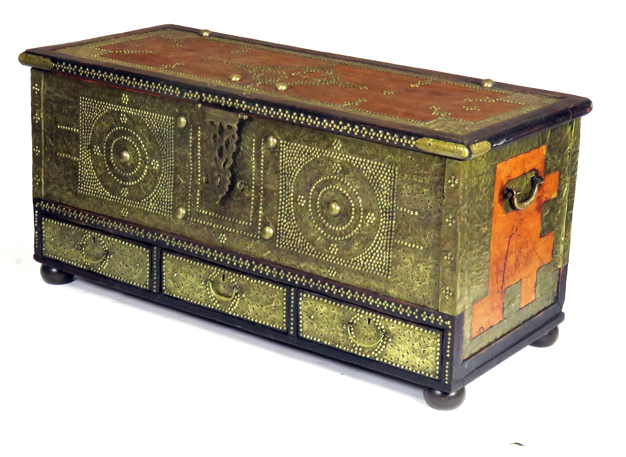 19th century Zanzibar trunk, circa 1850. Covered in decorative brass and metalwork over wood. Great storage with three drawers.