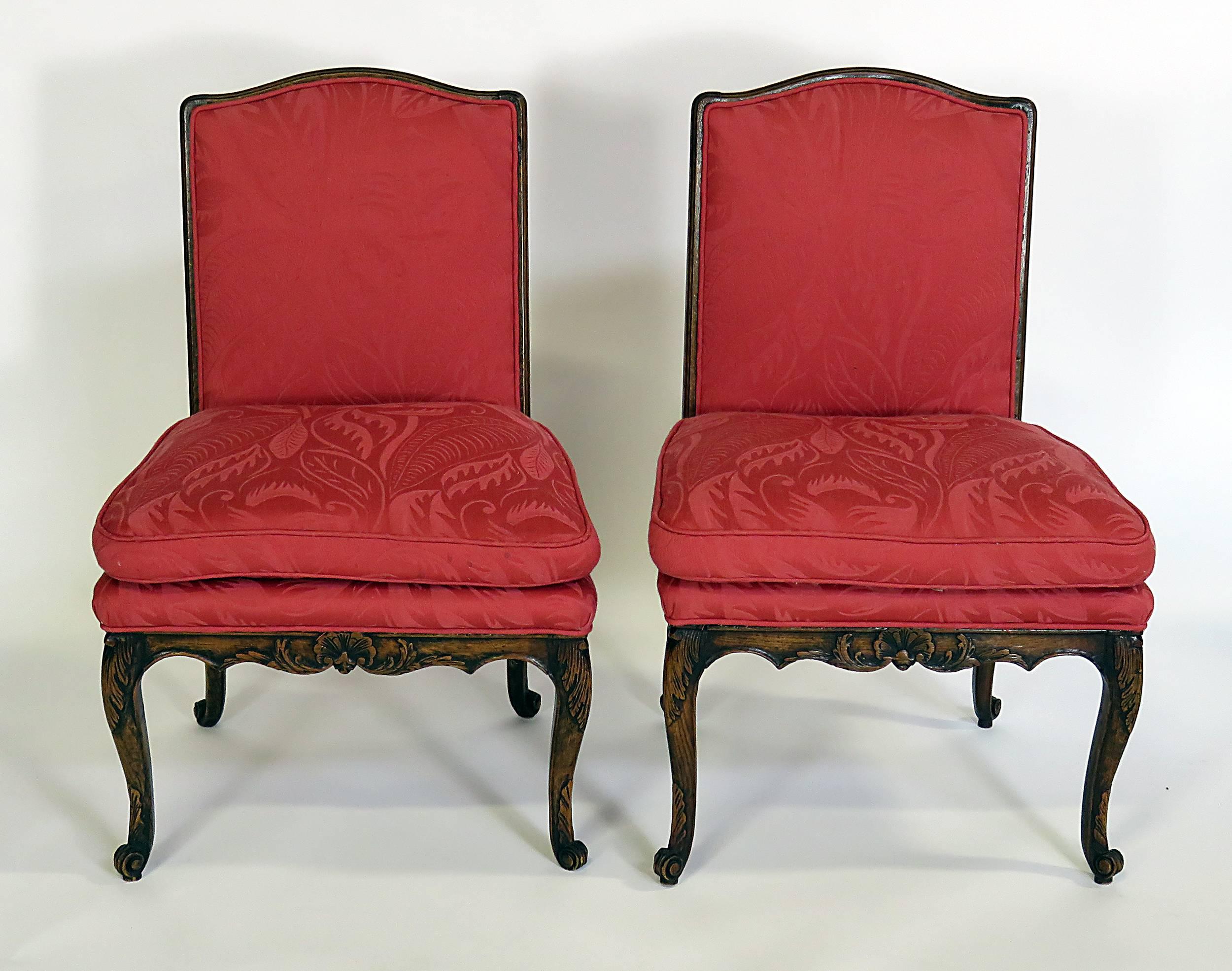 Elegant and comfortable Louis XVI upholstered armchairs. Standing on beautifully carved and solid legs. We actually have four but have priced them as pairs. They are carved chestnut and upholstery with unusually generous proportions. From a local
