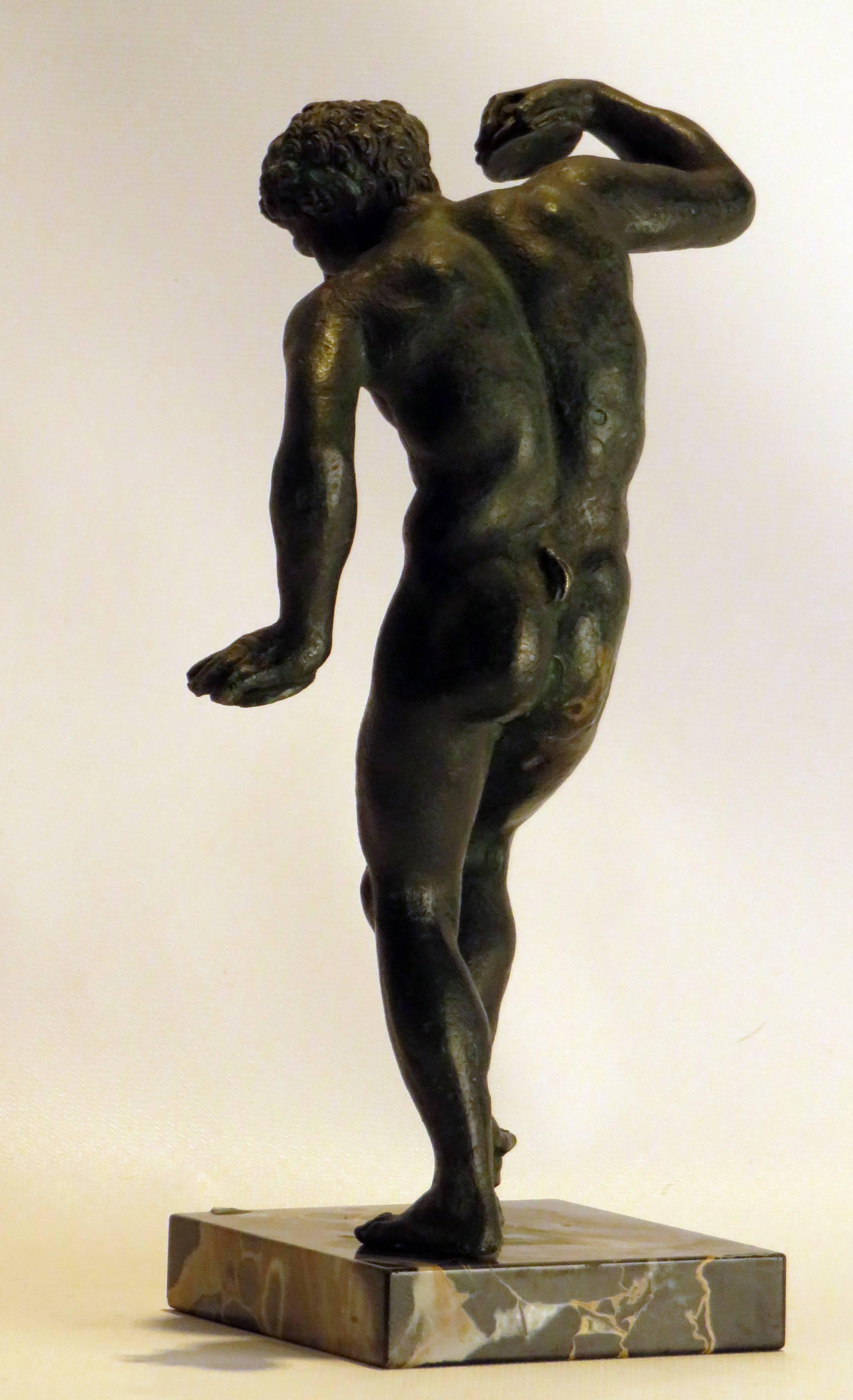 A handsome Grand Tour casting of a bronze Satyr playing cymbals while dancing. This statue was made in ancient Rome and has been a treasured souvenir for centuries. Made in Italy, circa 1880 on a marble base.
