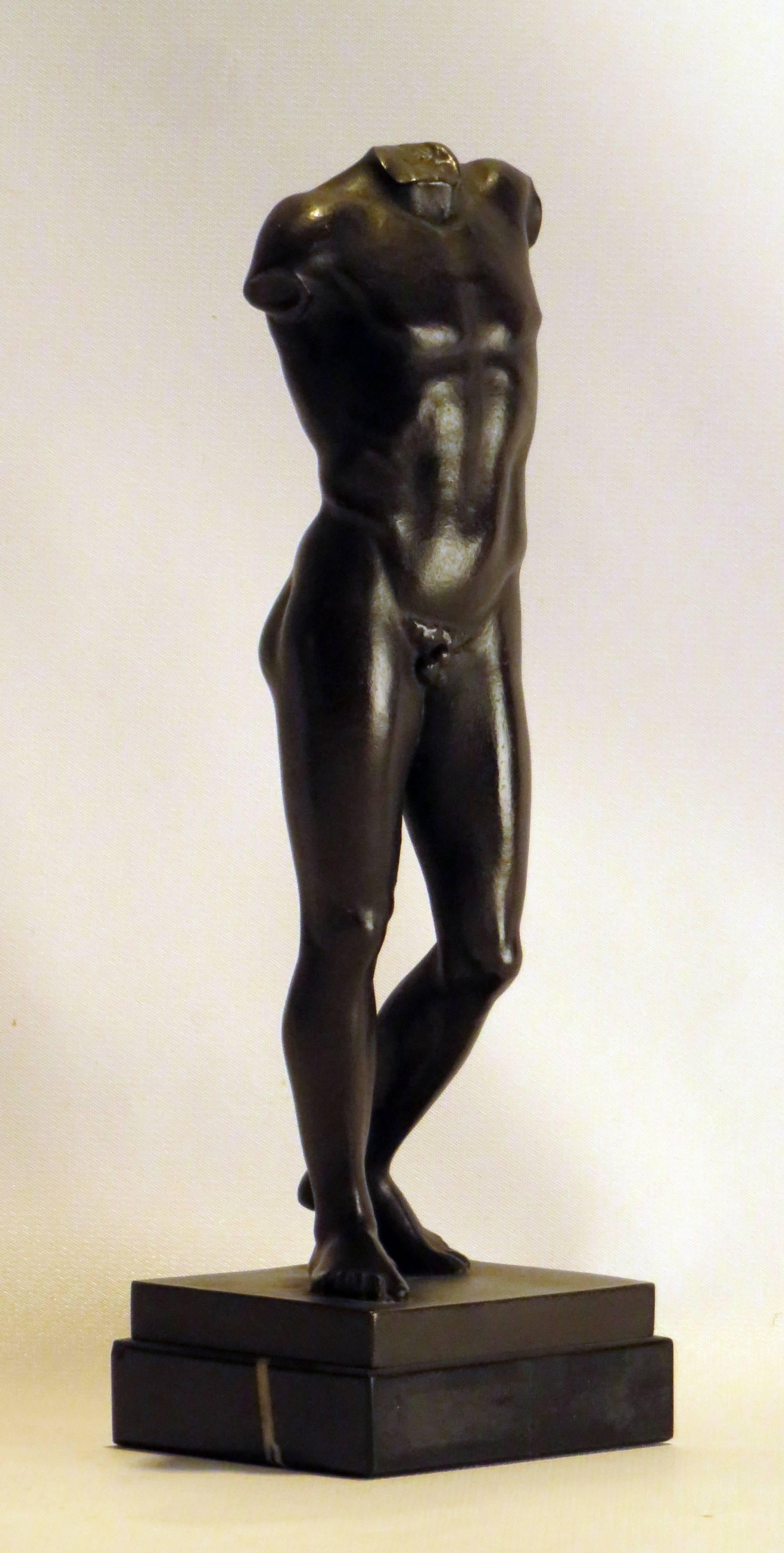 A wonderful casting in bronze of an athletic nude young man inspired by the marble originals seen so often in museums. This statue could represent a number of gods from antiquity. Mounted on black veined marble, Italy, circa 1880.