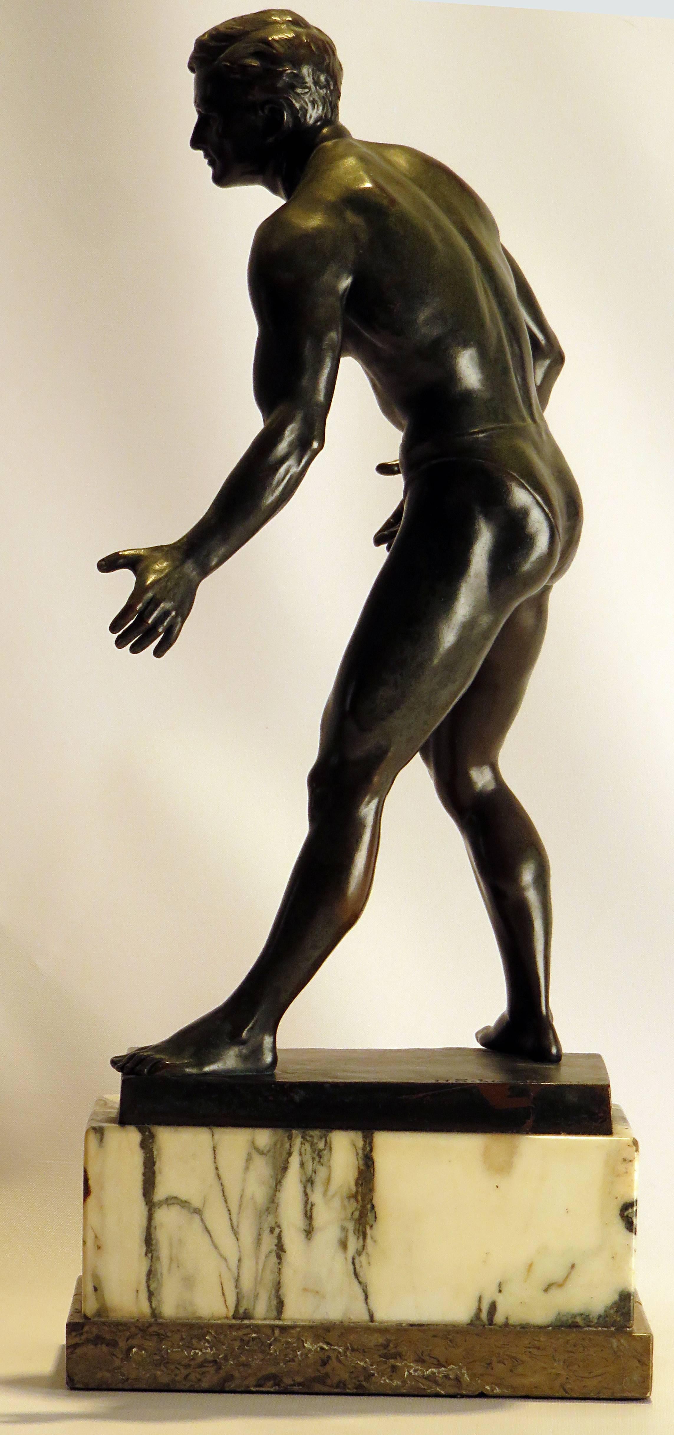 This large bronze is a well cast and modeled statue of a young and athletic wrestler. This reflects the 1920s interest in physical culture and what the idea of what a young man should look like. This piece originates in central Europe.