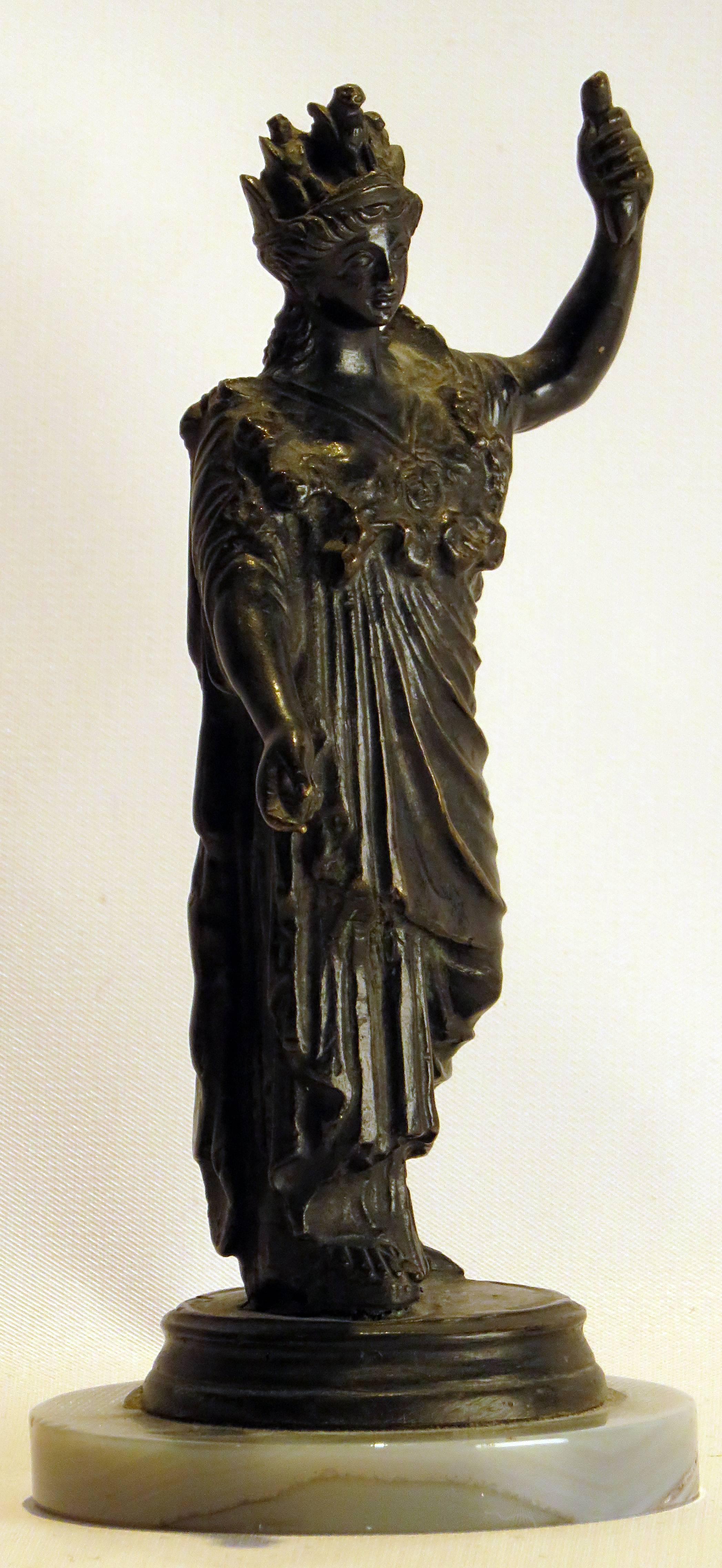 A Grand Tour bronze casting of Athena on a marble base. These wonderful pieces were made to be sold at historic sites to wealthy visitors.