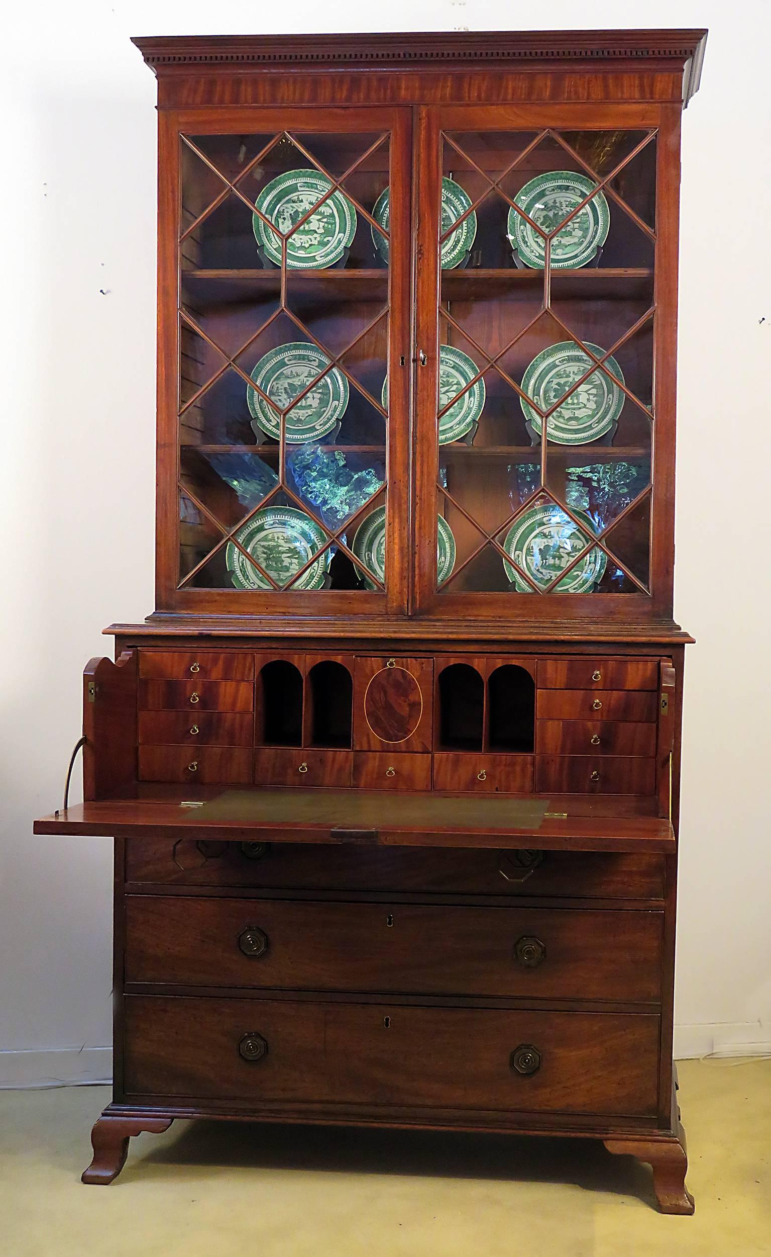 A very nice George III period mahogany secretary bookcase made in England during the last quarter of the 18th century. Standing on ogee bracket feet with beautifully glazed doors and what appears to be original handles. From a good old collection