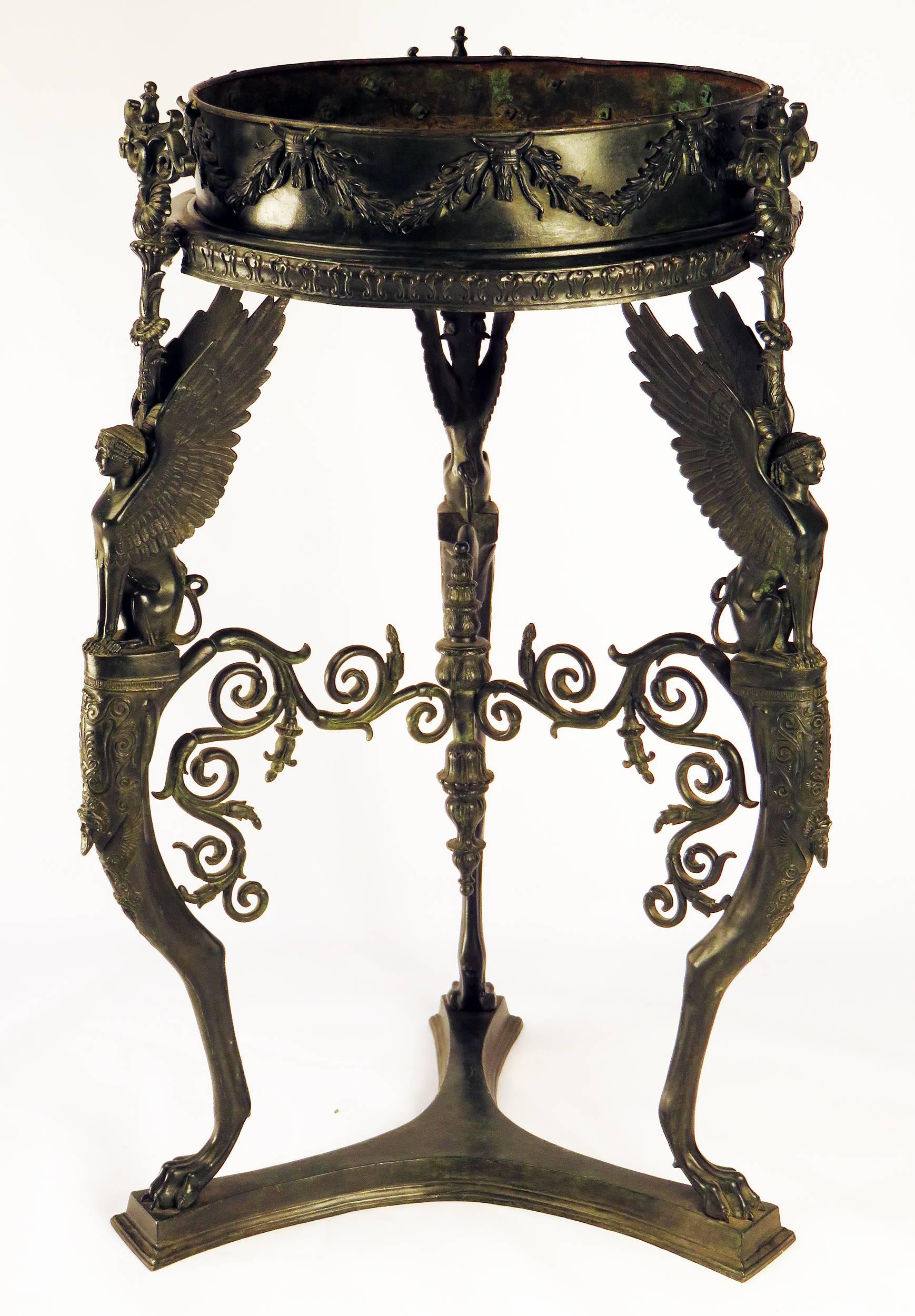 A 19th century patinated bronze stand, Athienienne, based on a Roman original found at Pompeii. A matching tripod was used at the baptism of Napoleon's son, the king of Rome. This type of stand was copied during the 18th-19th centuries. Acquired in
