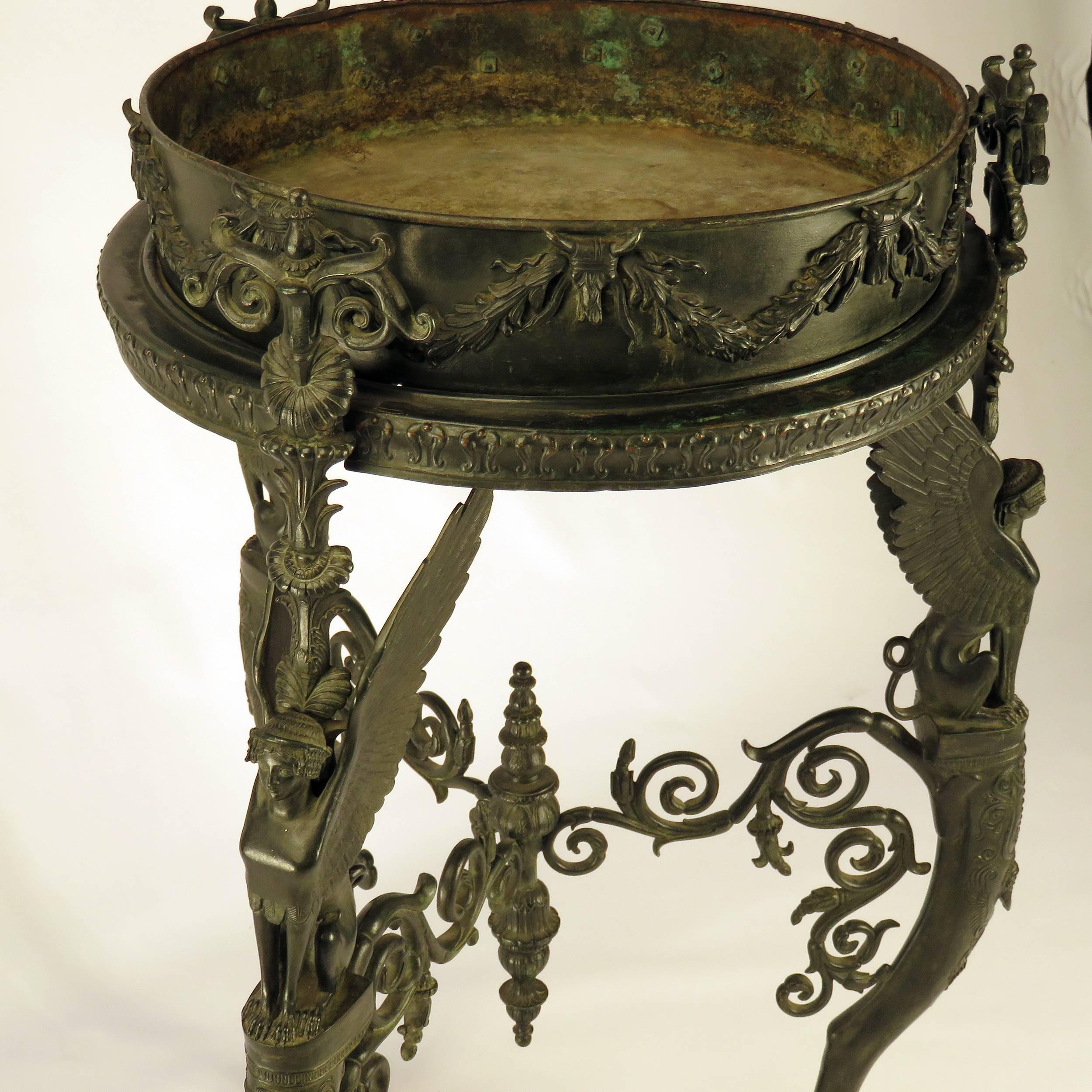 A 19th century patinated bronze stand, Athienienne, based on a Roman original found at Pompeii. A matching tripod was used at the baptism of Napoleon's son, the king of Rome. This type of stand was copied during the 18th-19th centuries. This example