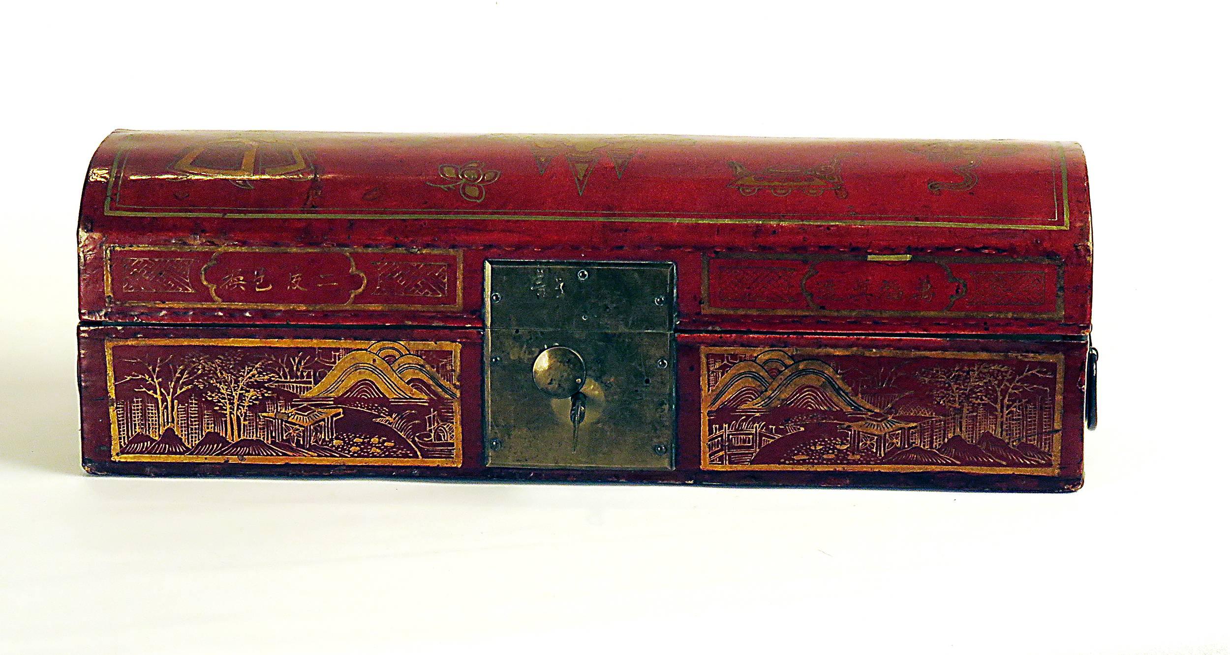 This leather lacquered and gilt domed box was made in China, circa 1870 and was used originally as a pillow and a place to store ones valuables. The original lock and hardware seem to be in place. These hard pillows are not seen in the west but are