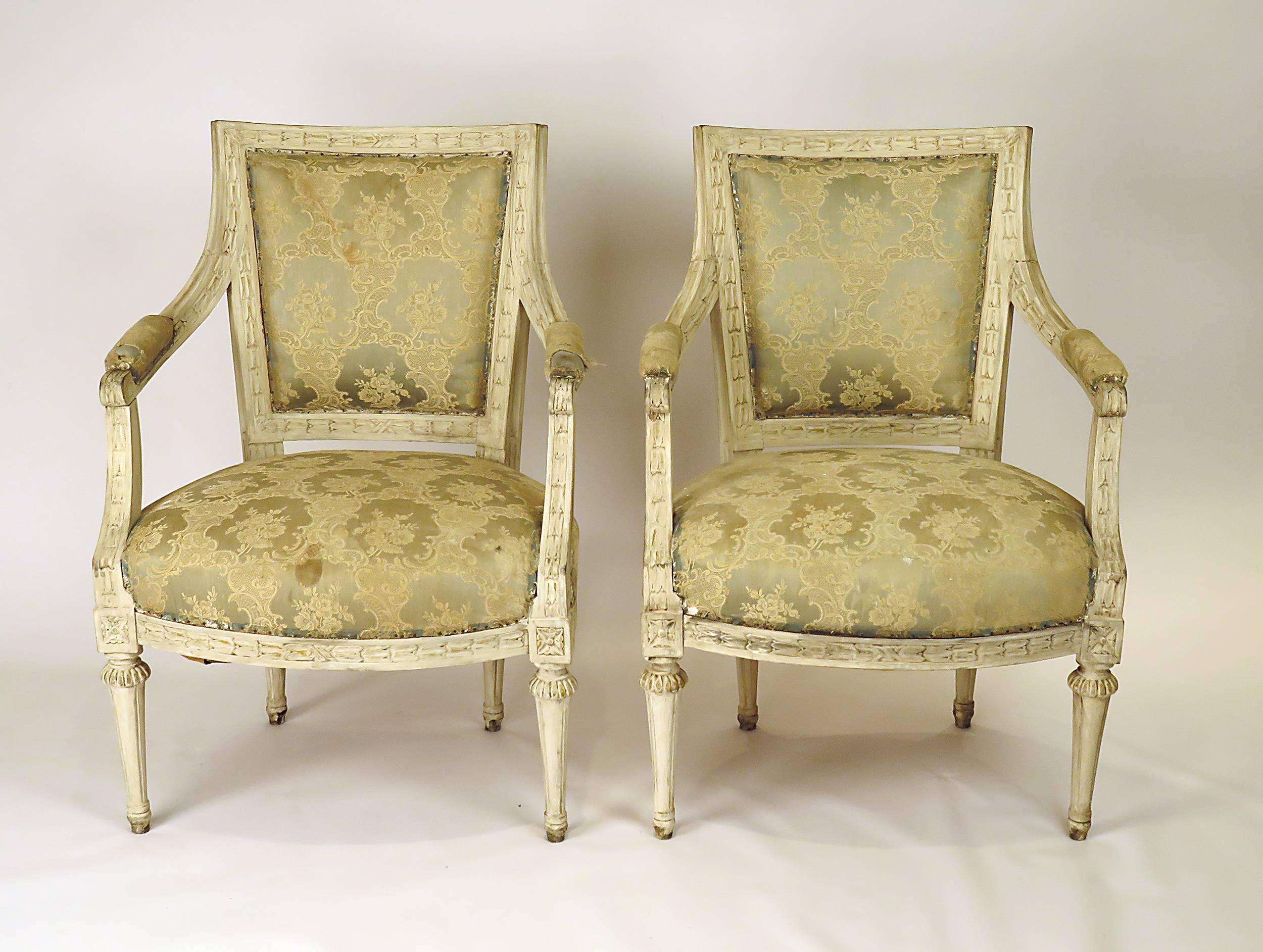 Made in Sweden late in the 19th or early in the 20th century. A very nice pair of Louis XVI style armchair with well carved accents. Recently tightened. The painted surface is later. This design originates about 100 years earlier in the Gustavian