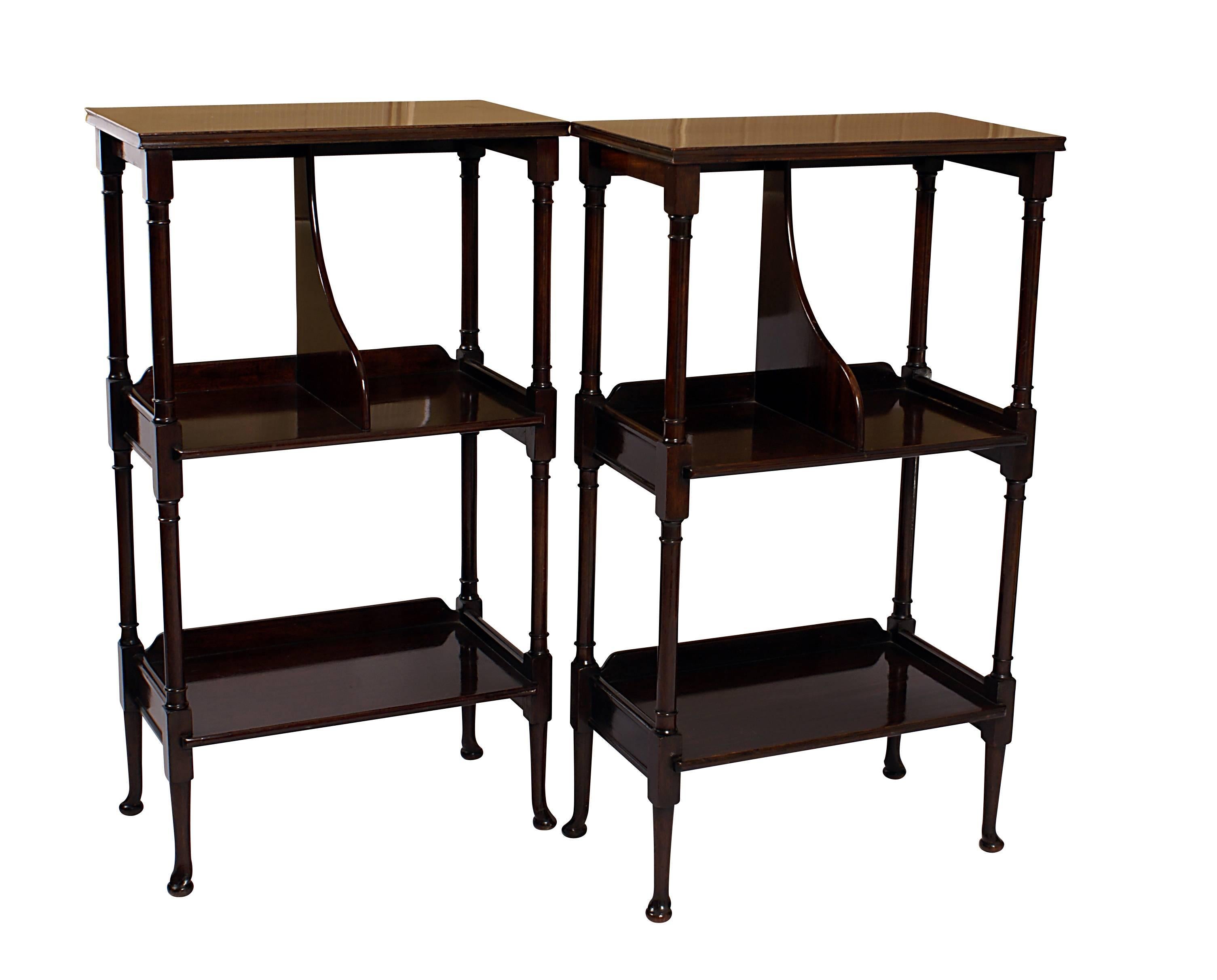 This pair of tables or shelves is a rarity. The design incorporates part turned and tapered legs ending in delicate pad feet. The shelves and tops are well figured flame mahogany. The shelves have been stabilized and strengthened by the addition of